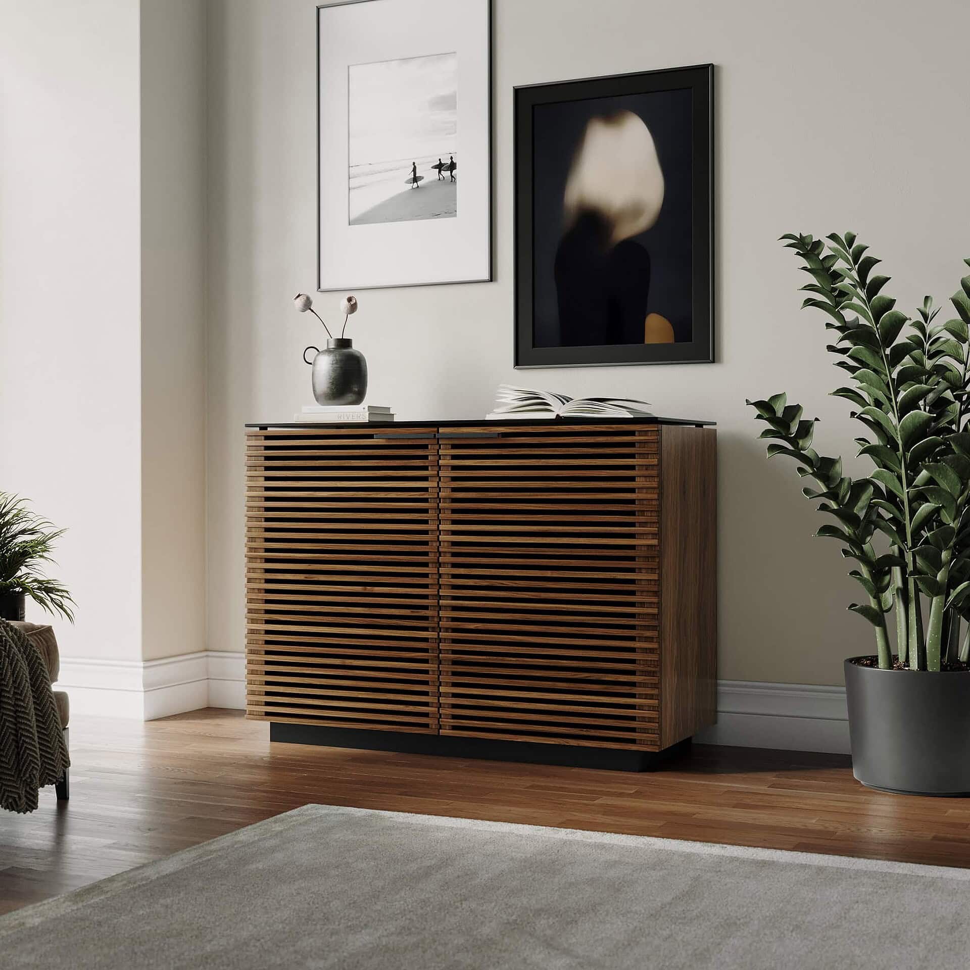 Modern wooden slatted sideboard with black top in contemporary living room decor.