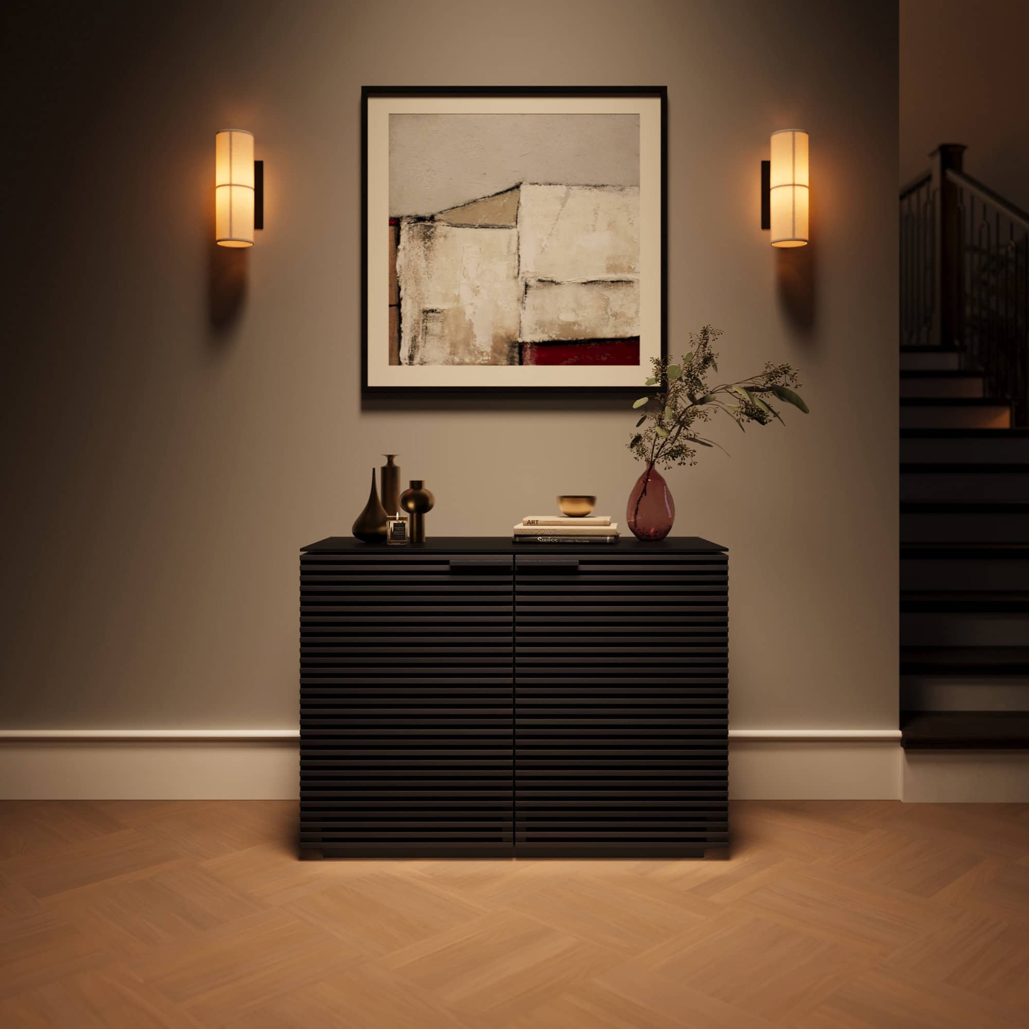 Elegant black modern sideboard with decorative vases and artwork, stylish lighting, perfect for contemporary interiors.