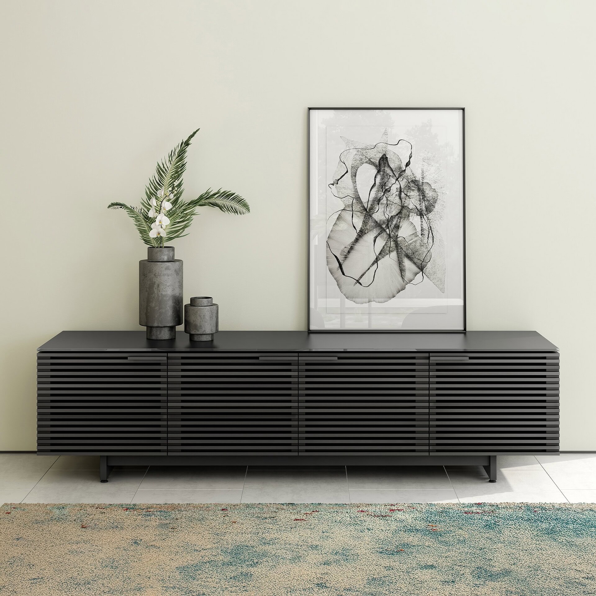 Sleek black modern sideboard with decorative vases and abstract art, perfect for contemporary interior decor.