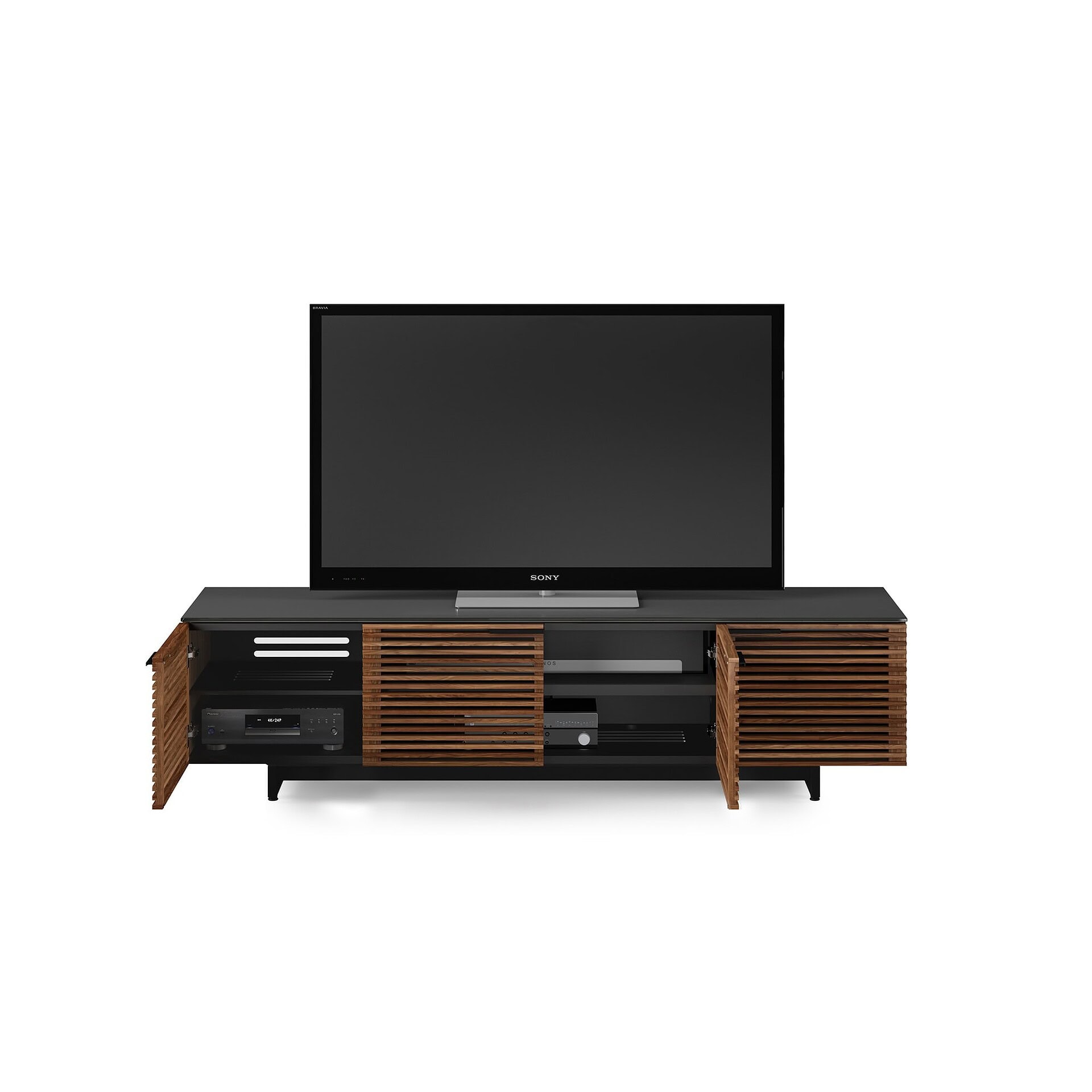 Modern wooden TV console with black top and slatted doors, ideal for contemporary living rooms.