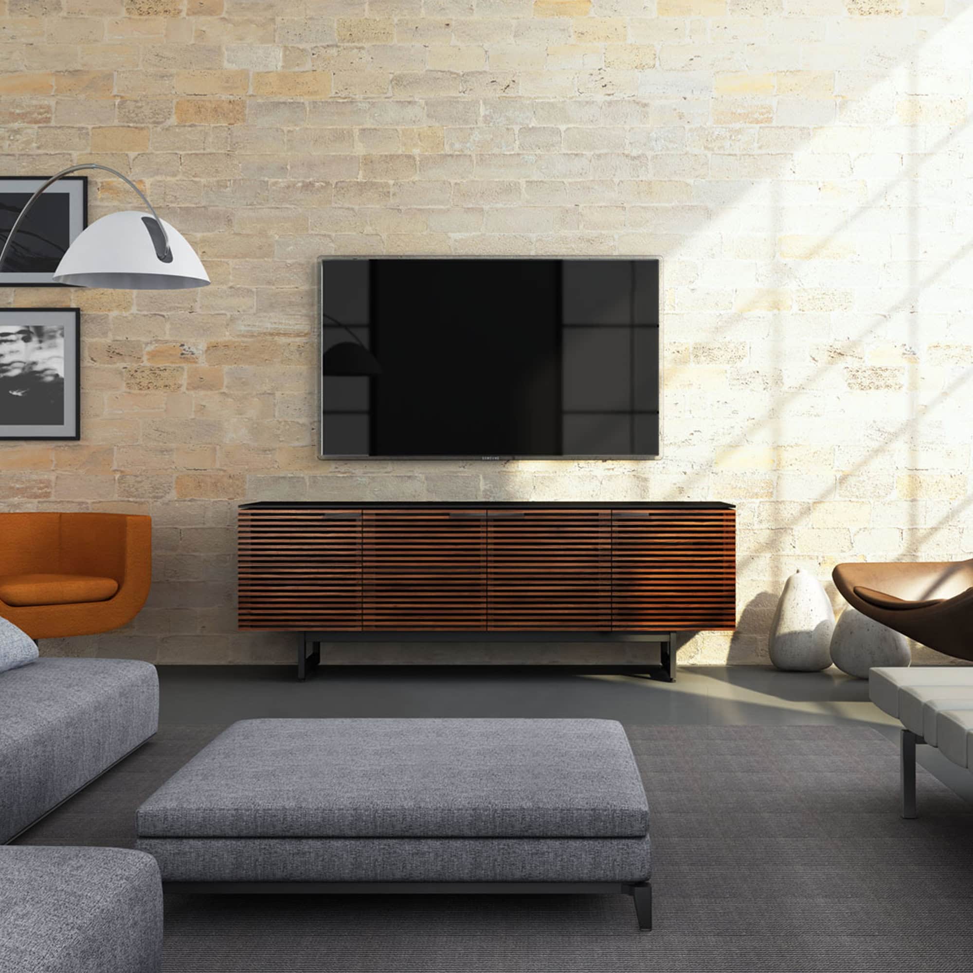 Modern living room with sleek TV console and stylish decor from Sklar Furnishings.