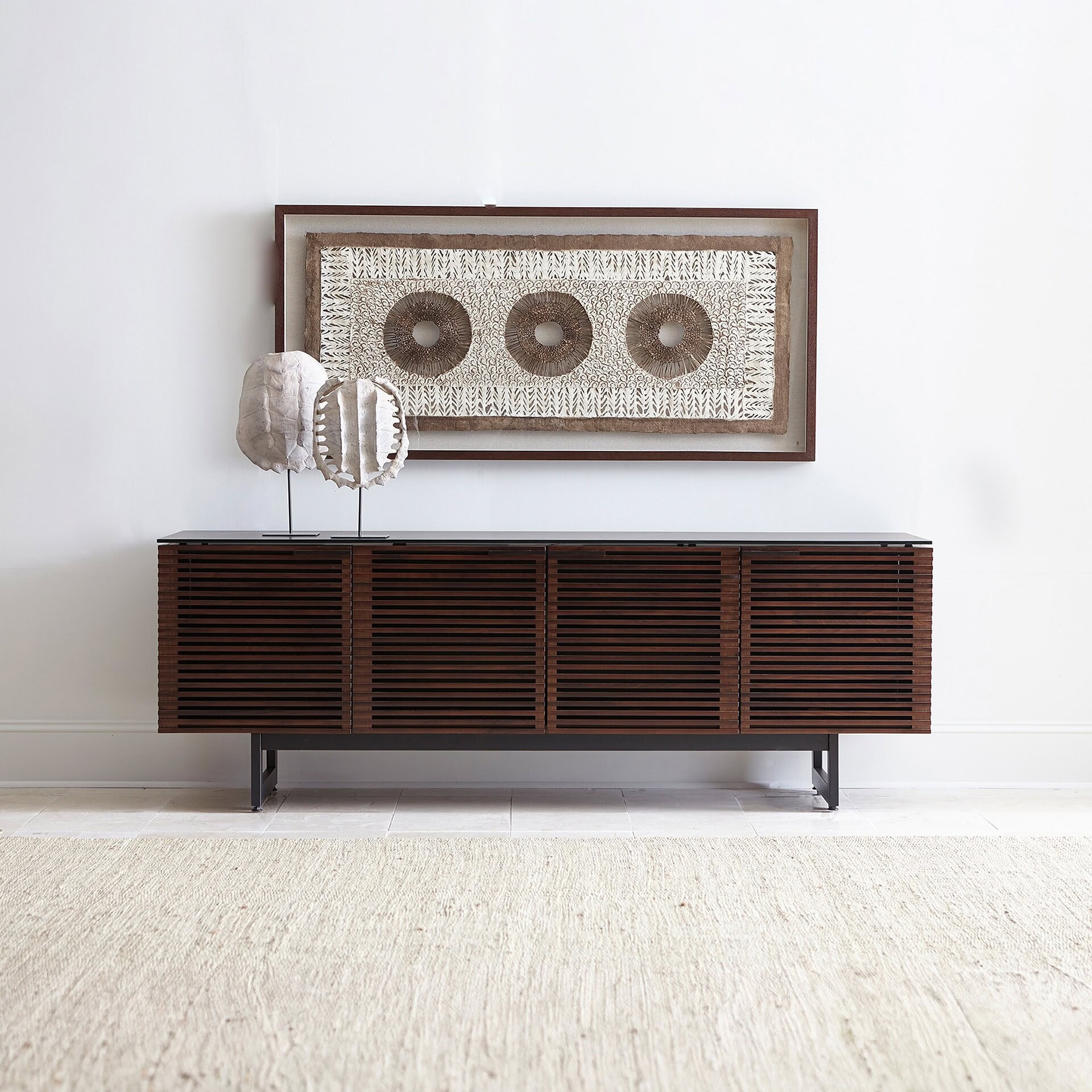 Corridor 8179 Media Console TV Stand in natural walnut finish, styled in a modern living room with wall-mounted TV.