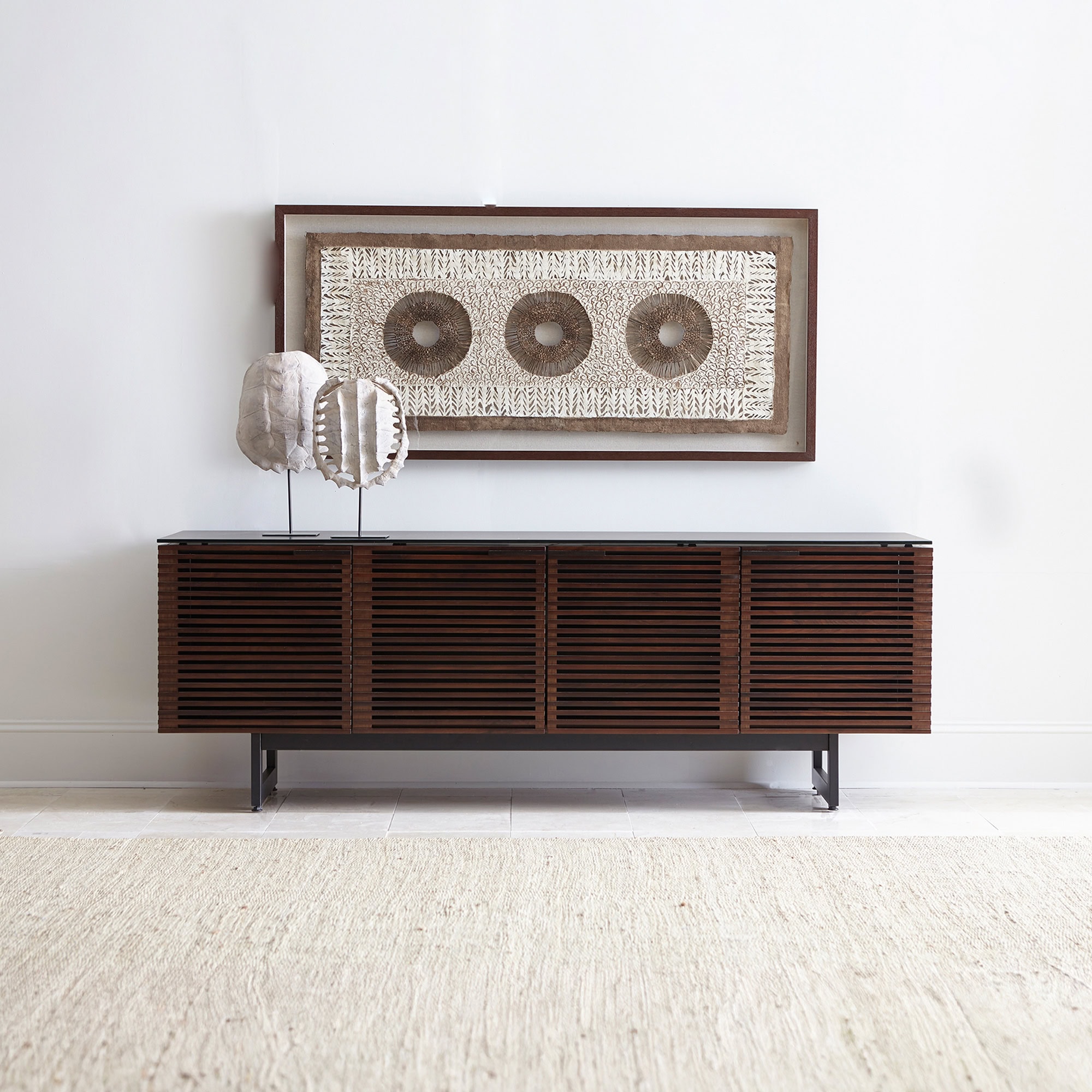 Corridor 8179 Media Console TV Stand in natural walnut finish, styled in a modern living room with wall-mounted TV.