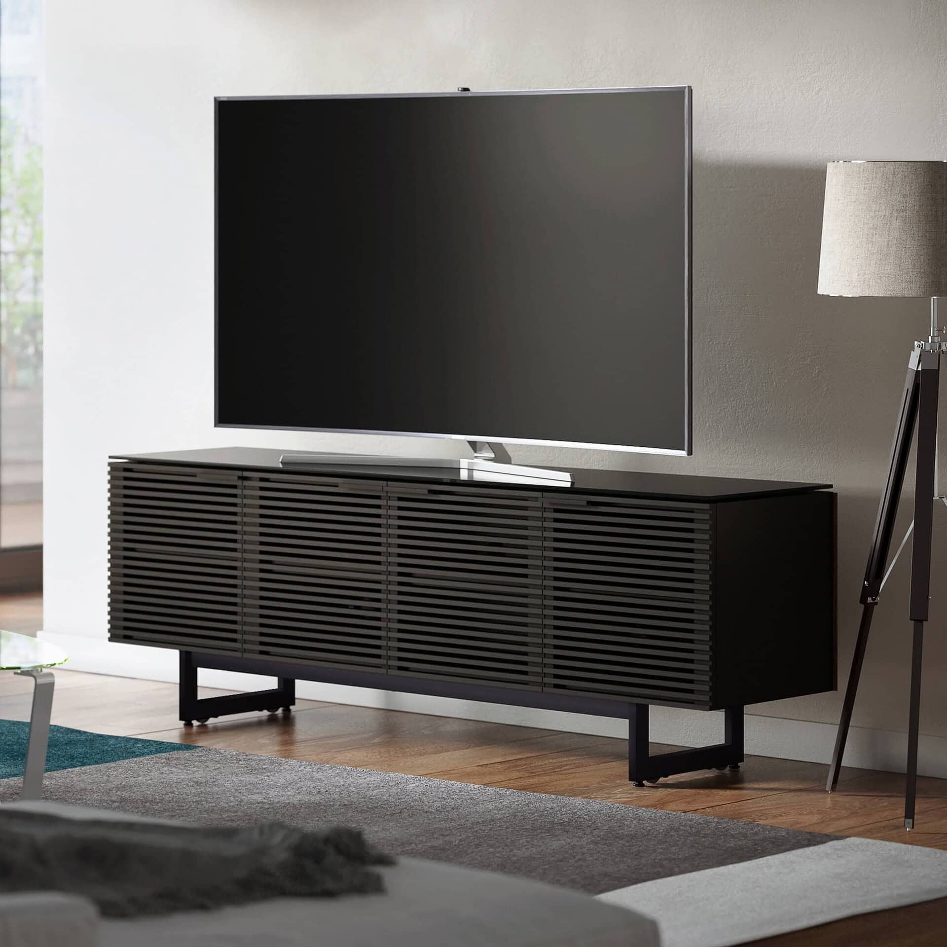 Contemporary black slatted wood TV console with sleek modern design for living rooms.