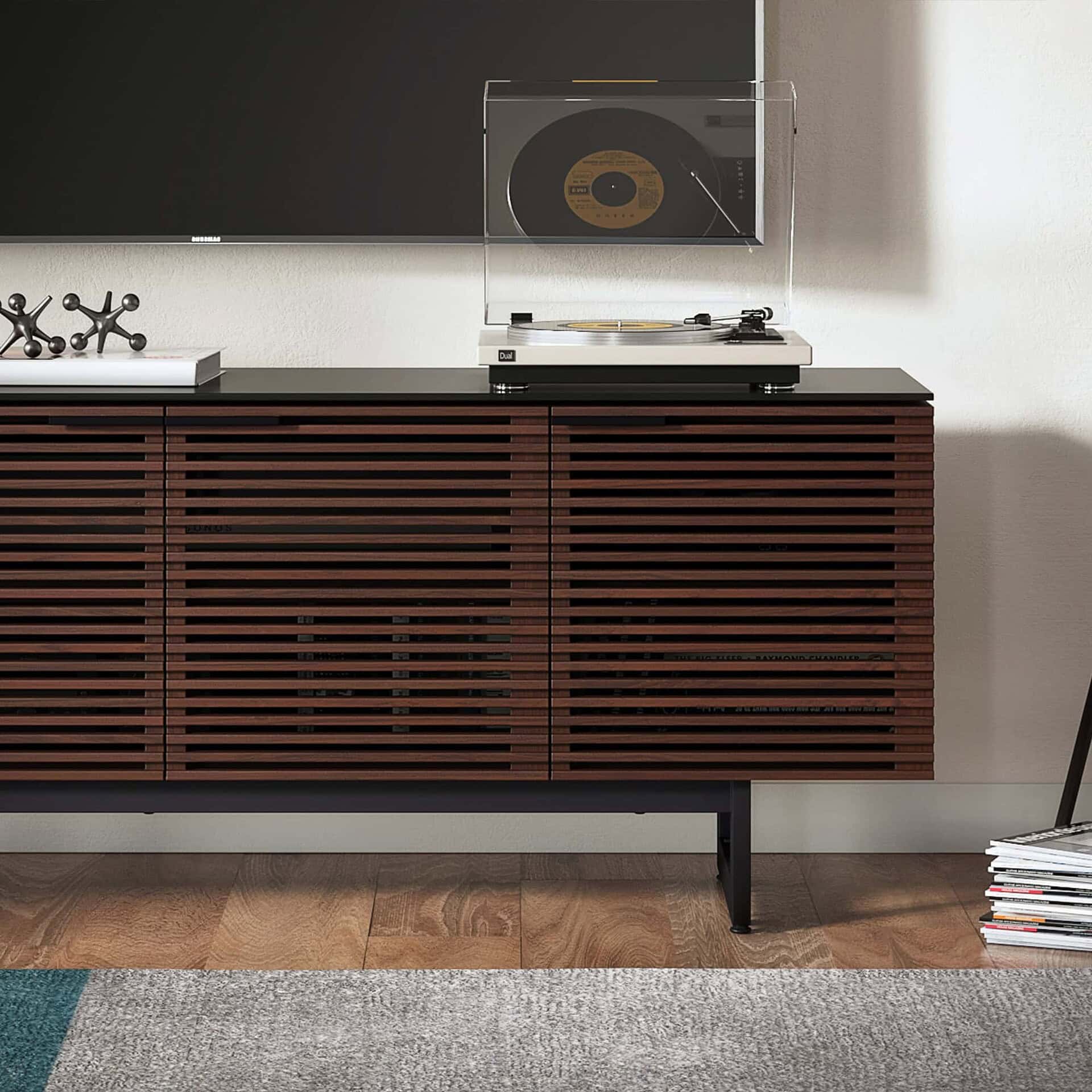 Sleek wooden media console with slatted design, perfect for modern living rooms.
