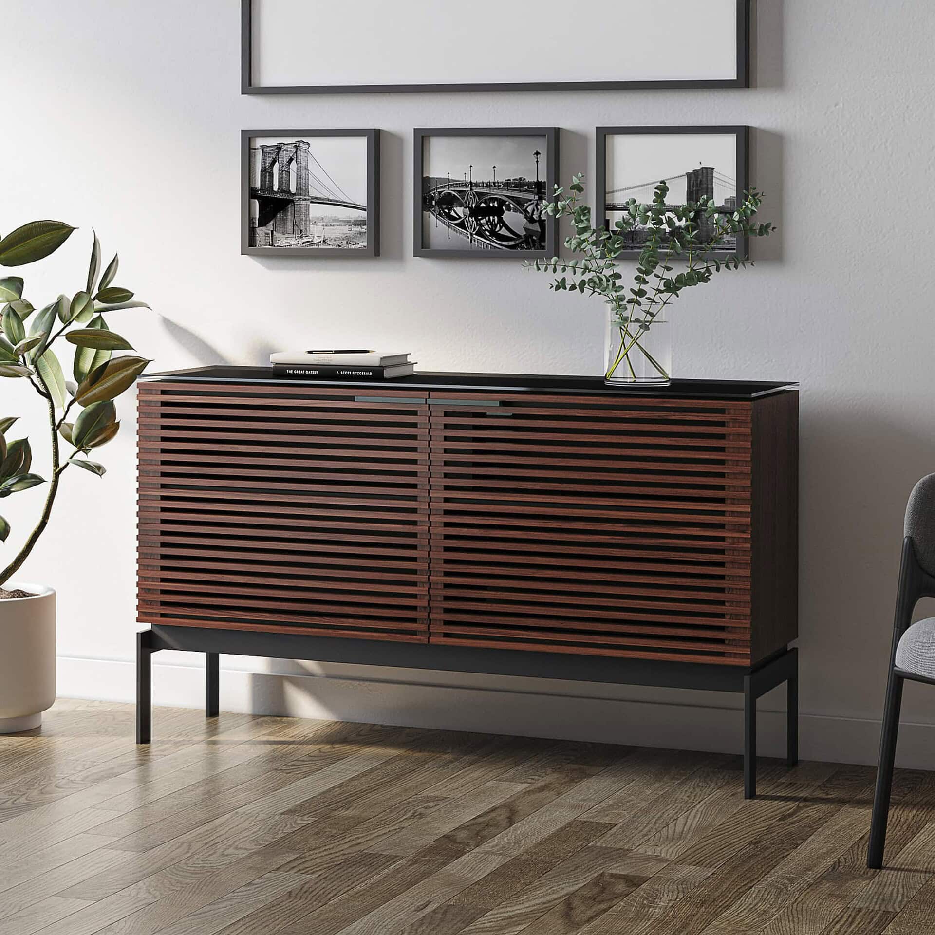 Mid-century modern wooden sideboard with slatted doors for stylish storage.