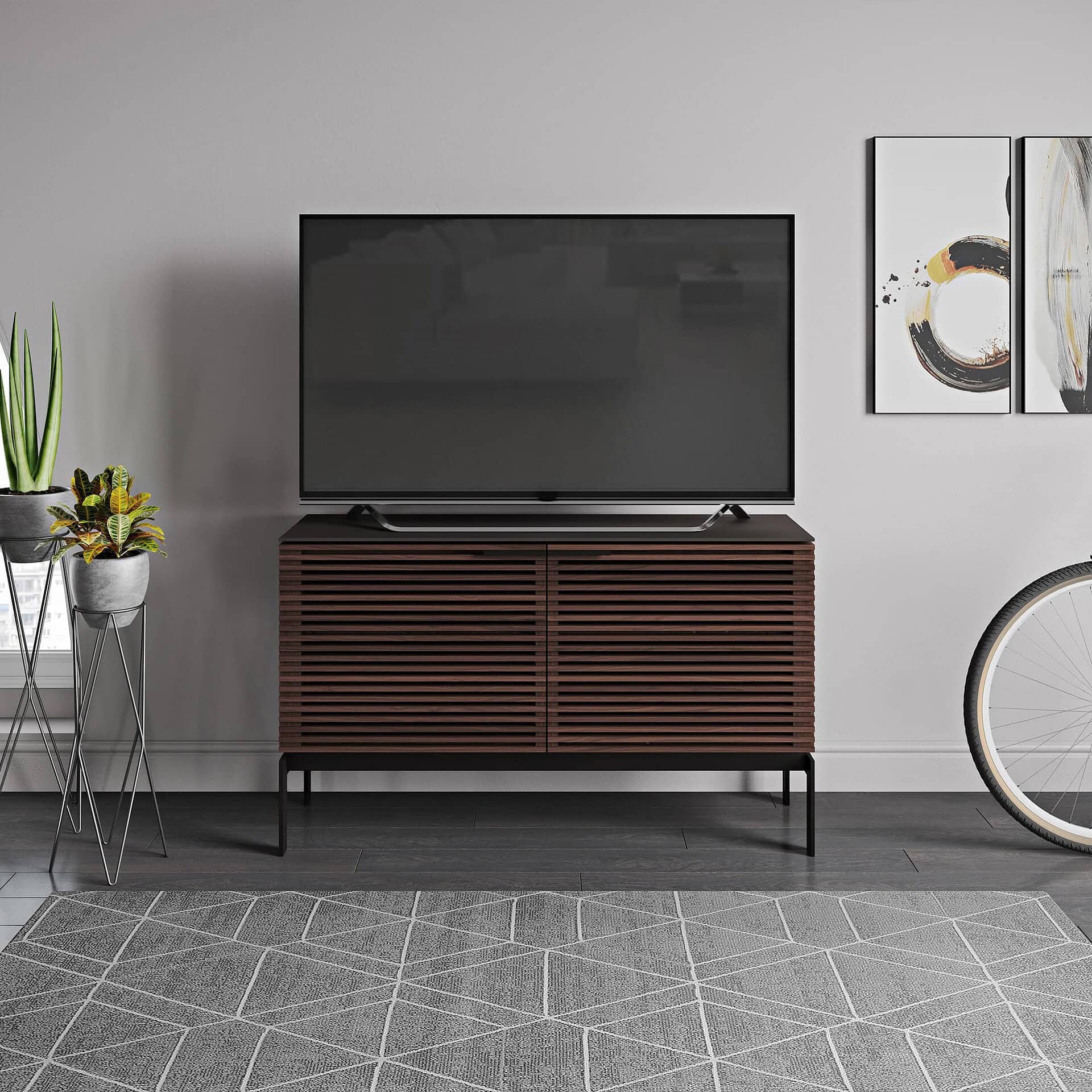 Sleek wooden TV stand with modern slatted design, ideal for contemporary living rooms.