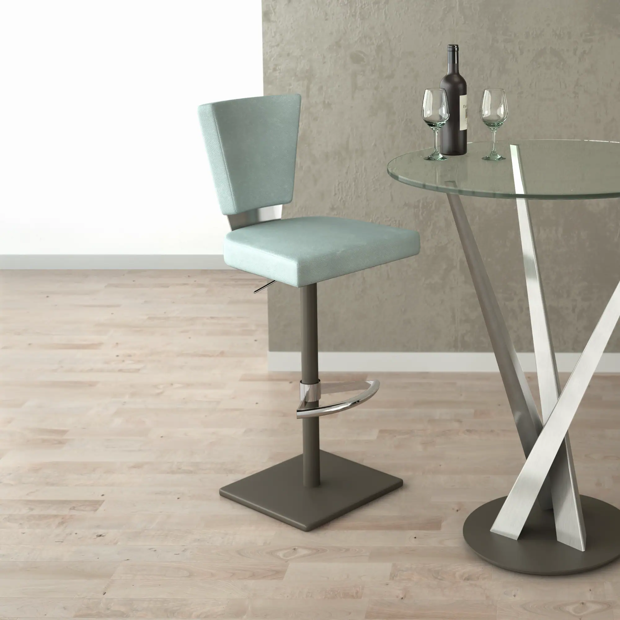 A light blue bar stool next to a round glass table with a wine bottle and two wine glasses on it. The room has light wooden floors and a textured gray wall.
