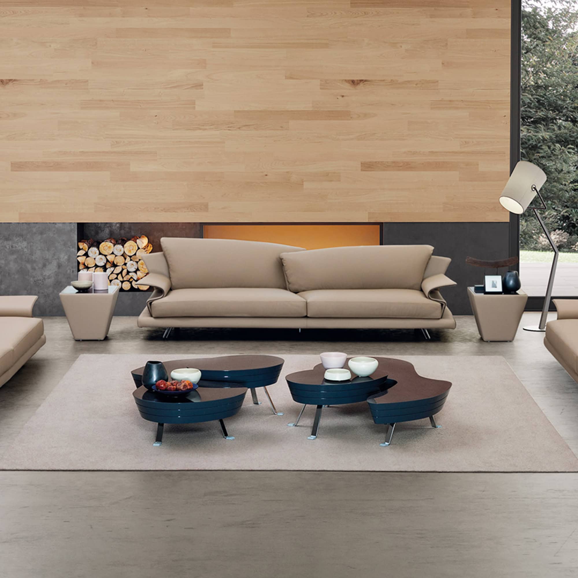John Coffee Tables styled together in a modern interior with wood wall backdrop.