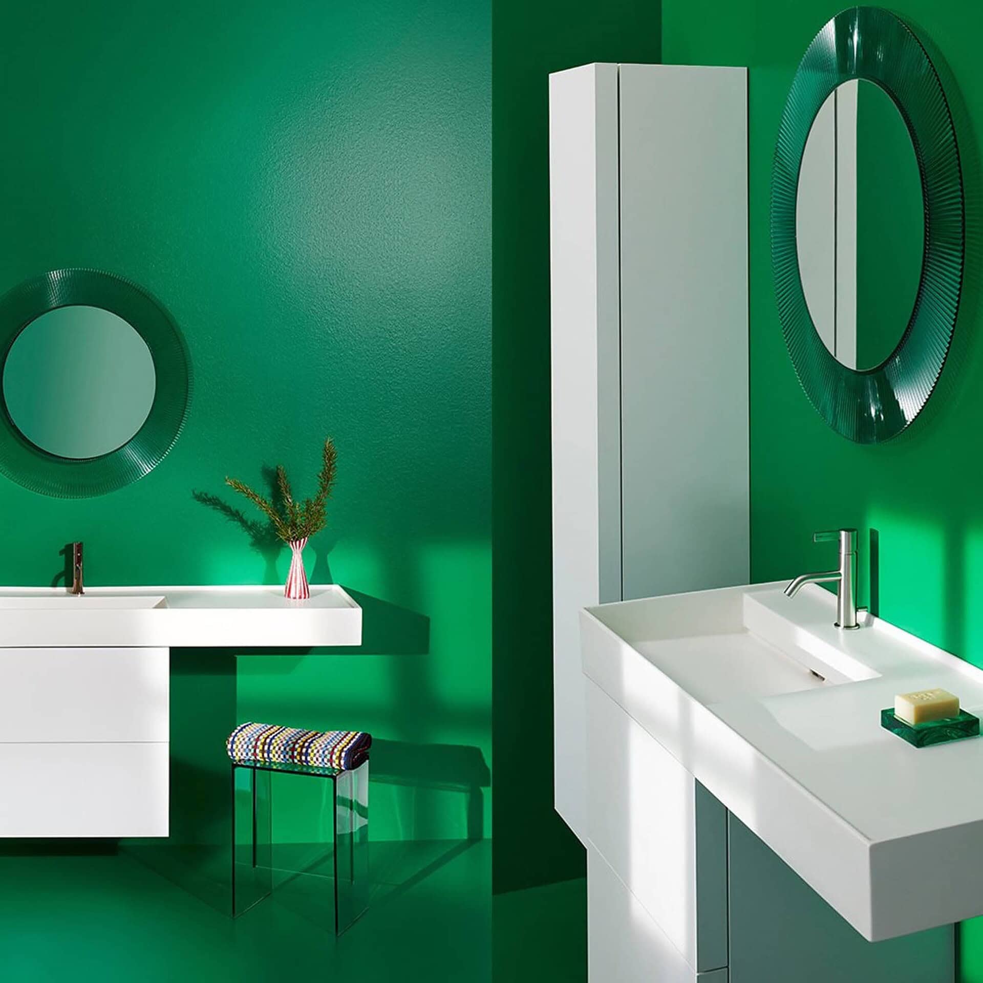 Kartell All Saints round mirror with pleated green frame featured in a contemporary green bathroom interior.