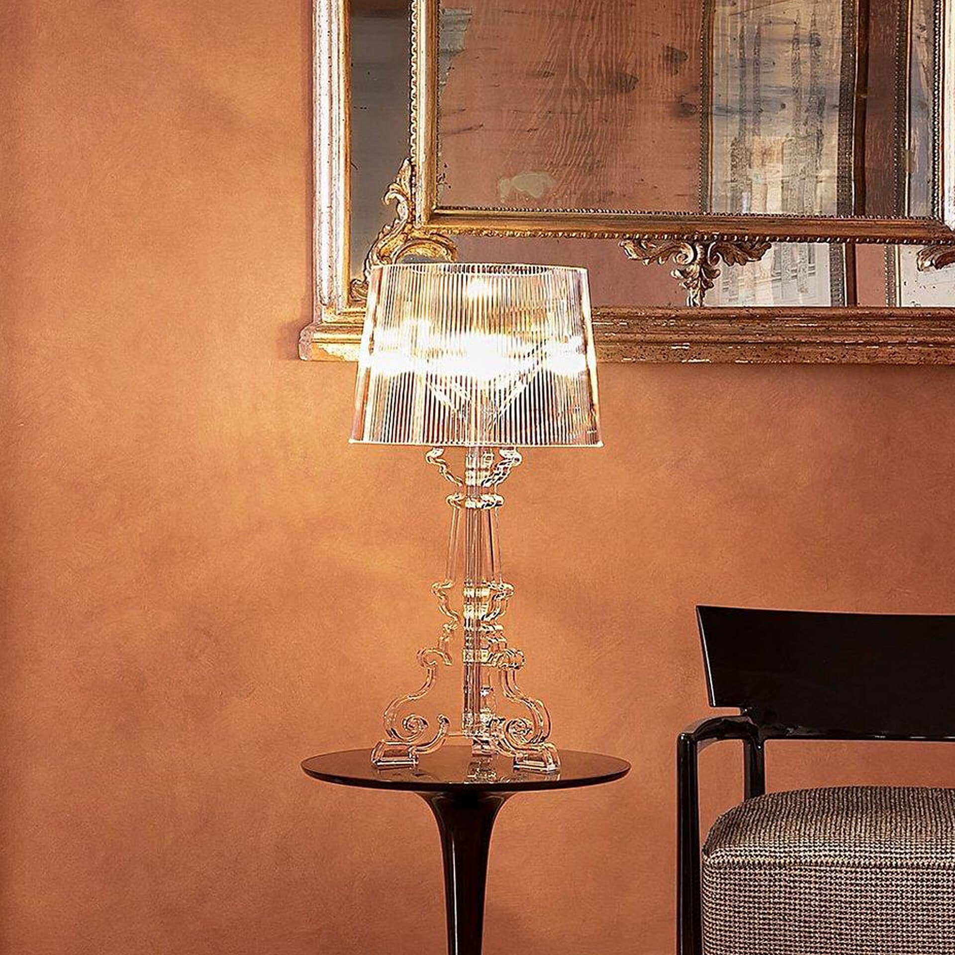 Elegant glass table lamp with crystal base and modern shade, in a stylish interior setting.