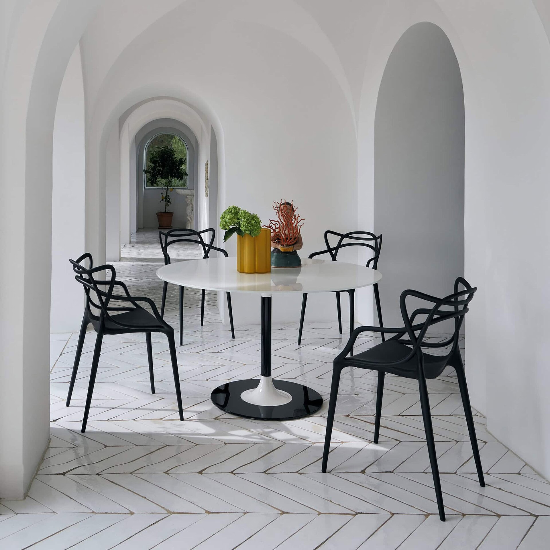 Masters Dining Chairs in black, modern dining area with arched architecture and minimalist style