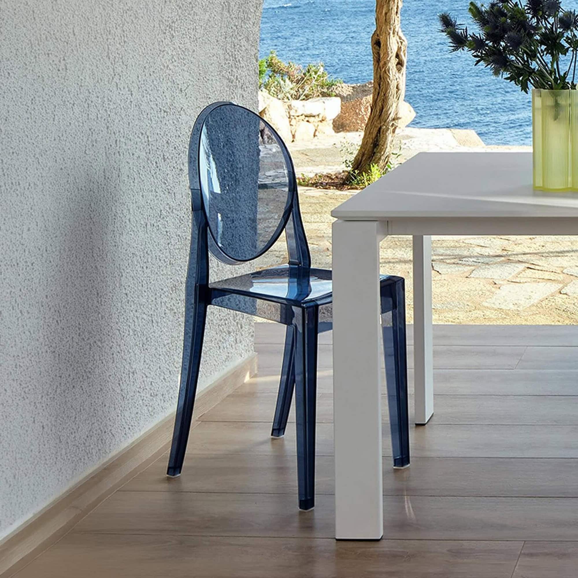 Transparent blue acrylic dining chair by Sklar Furnishings.
