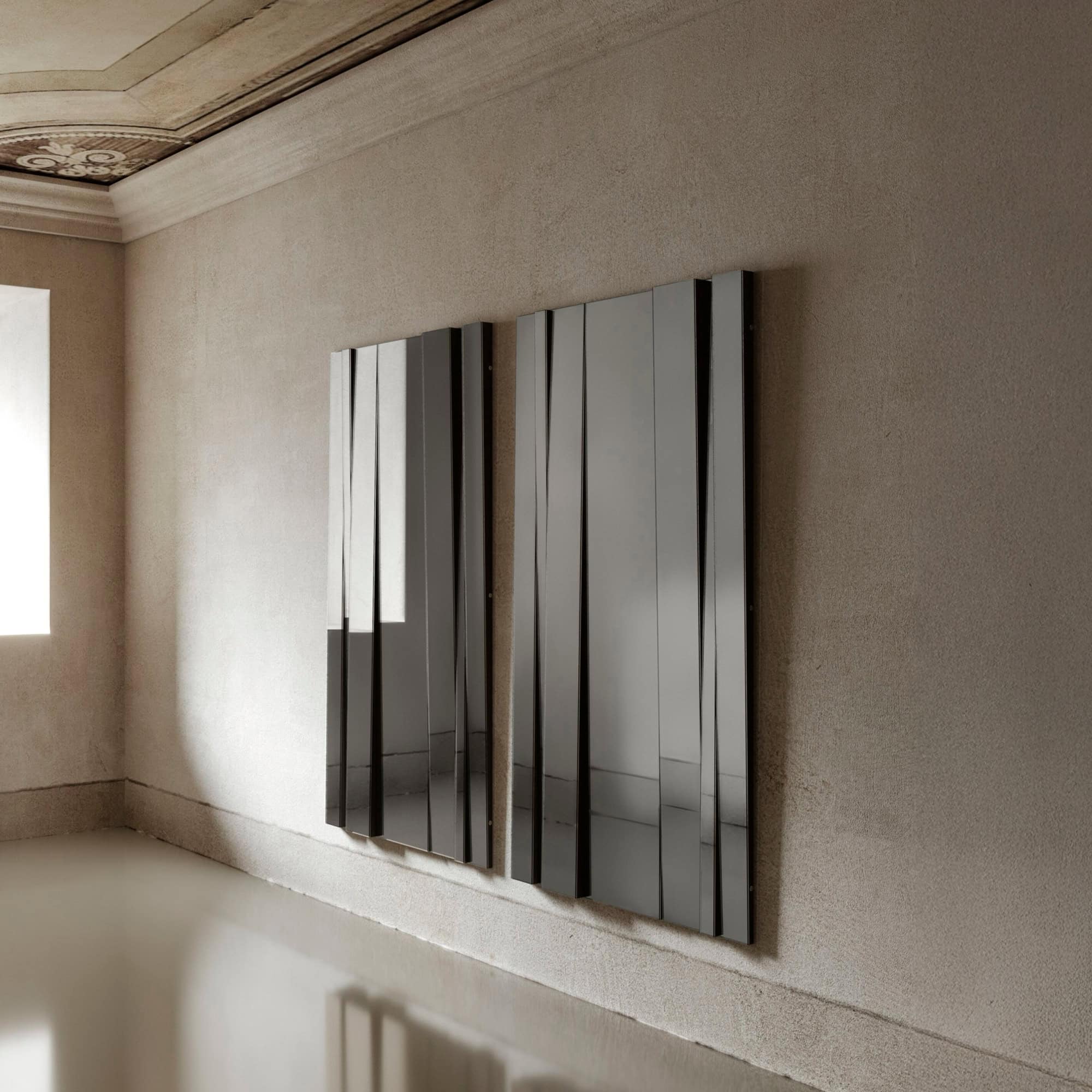Large Fittipaldi Mirror installation in modern hallway.
