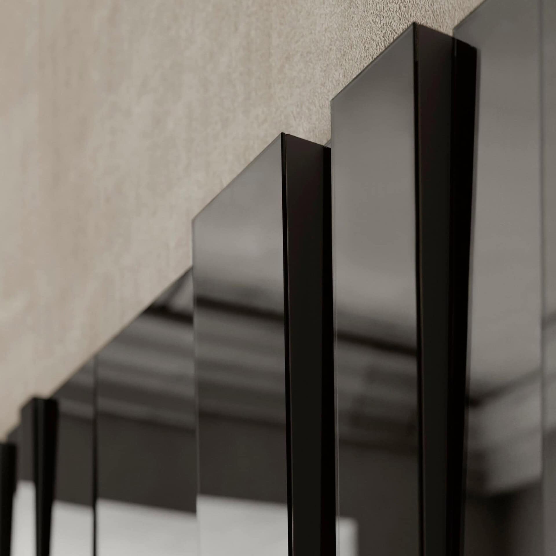 Detail view of Fittipaldi Mirror edges in smoked glass.