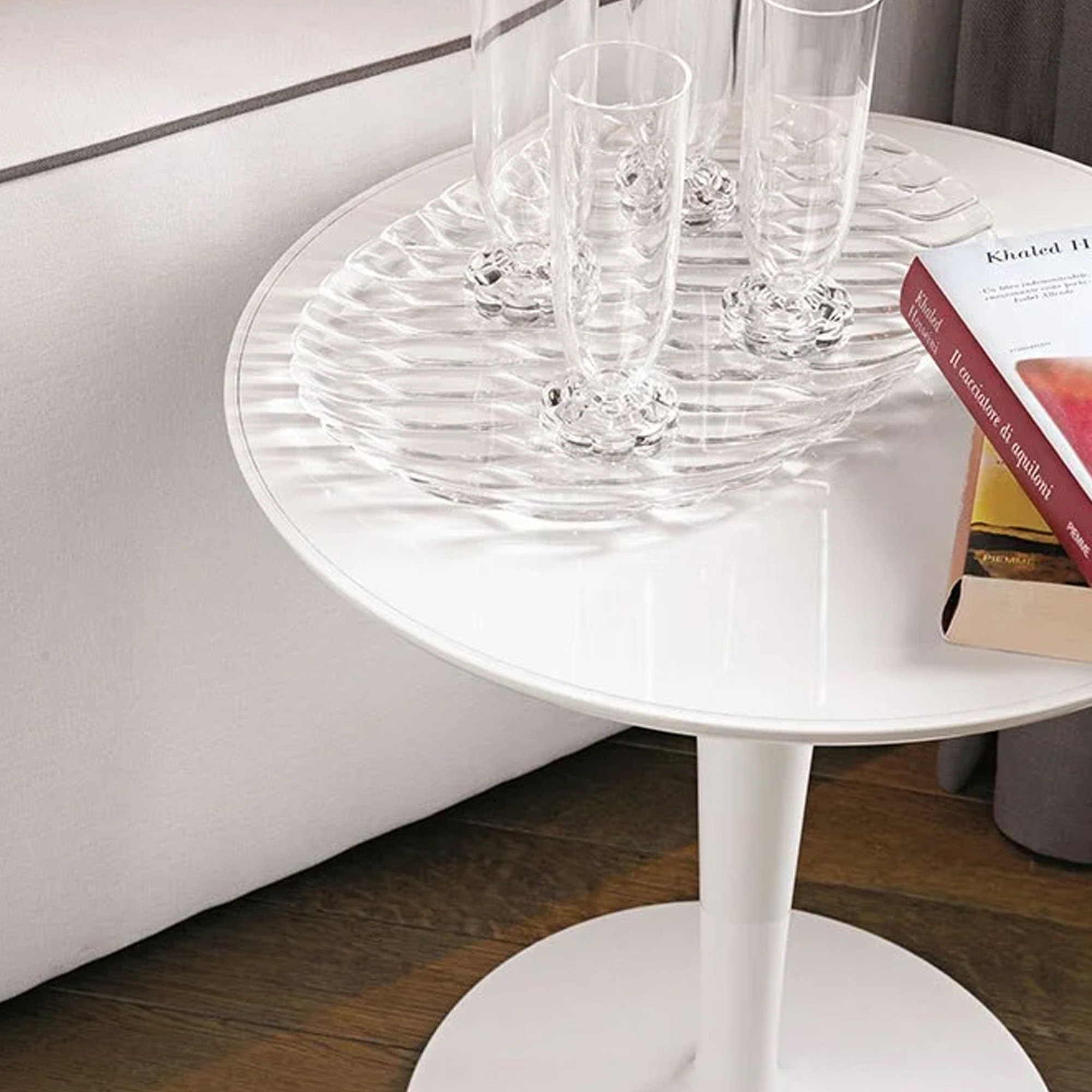 Tip Top Table in white finish styled as a side table with glassware on top.