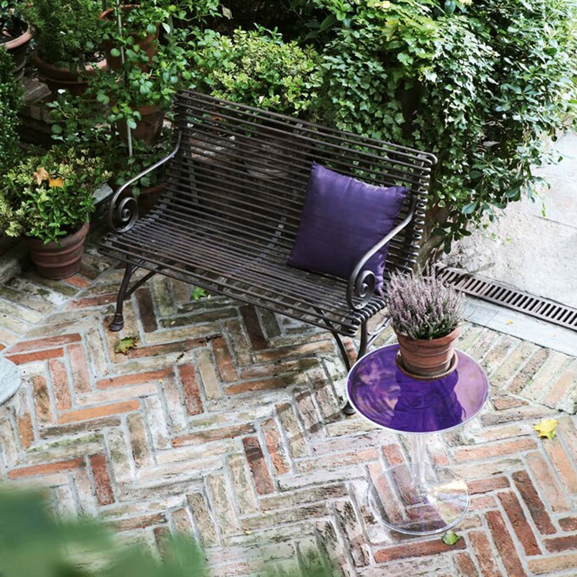 Tip Top Table styled outdoors with a purple top and greenery in the background.