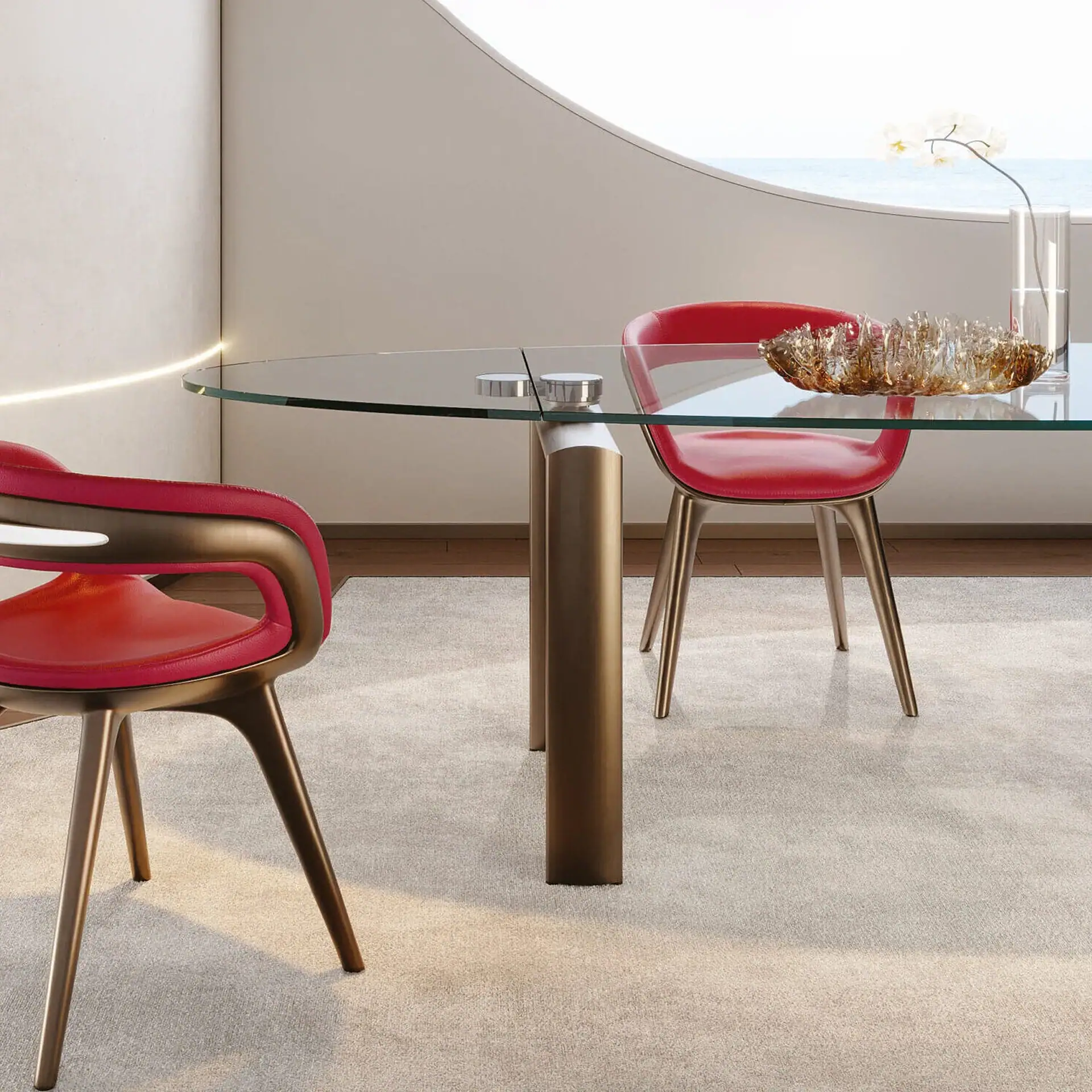 Modern glass dining table with red chairs in stylish room setting.