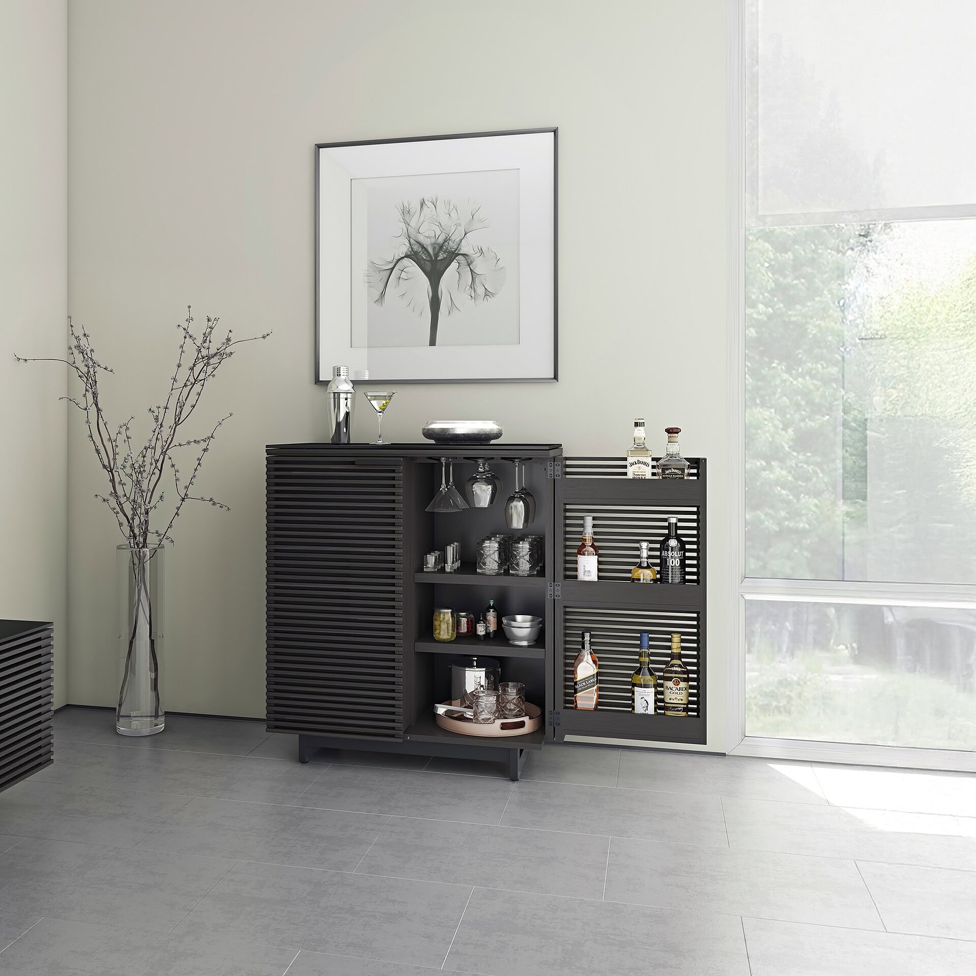 Stylish black bar cabinet with glassware and liquor bottles, modern home bar furniture from Sklar Furnishings.