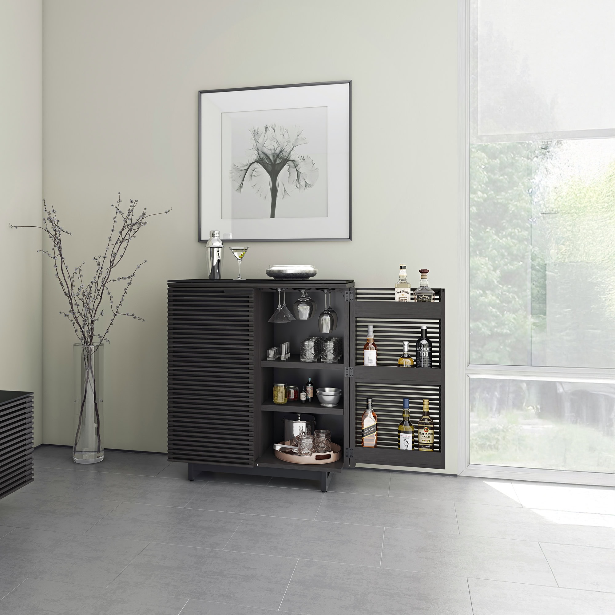 Stylish black bar cabinet with glassware and liquor bottles, modern home bar furniture from Sklar Furnishings.