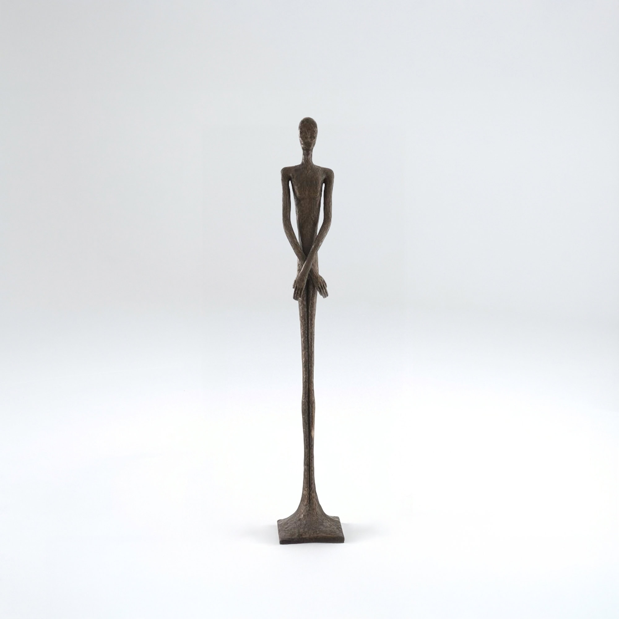Stylish modern metal sculpture of a female figure, perfect for home or office decor.