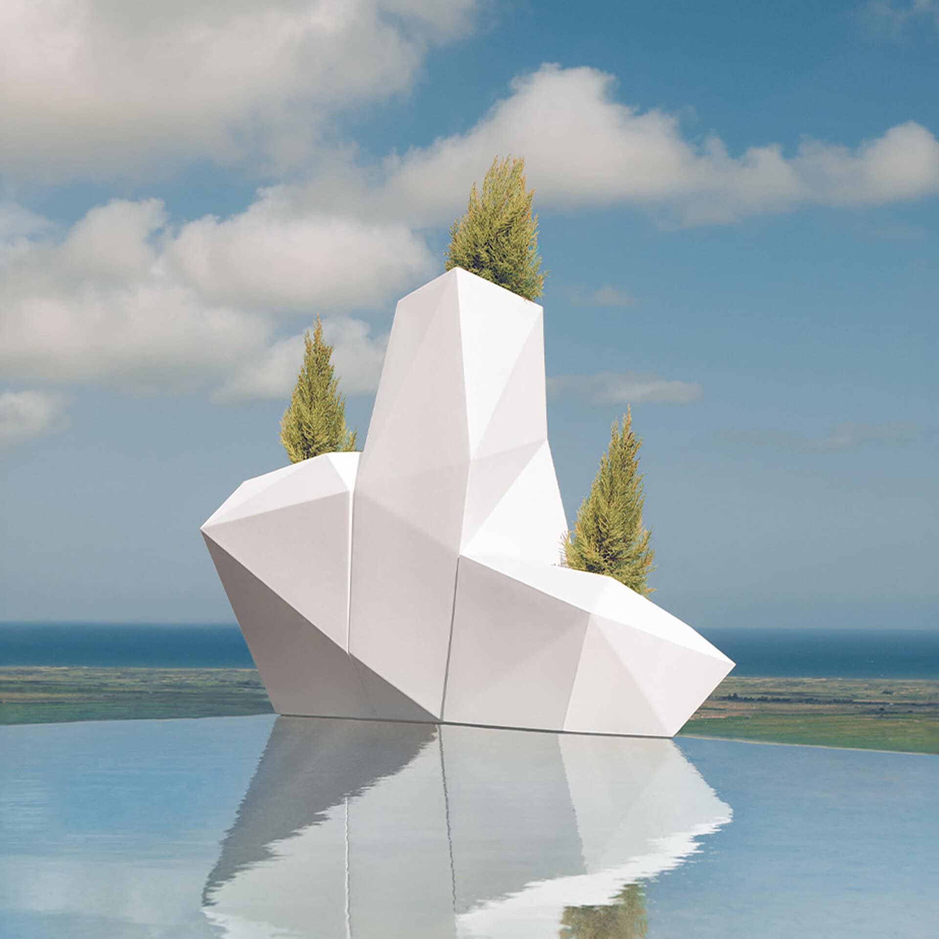 Modern geometric outdoor sculpture with trees, overlooking water.