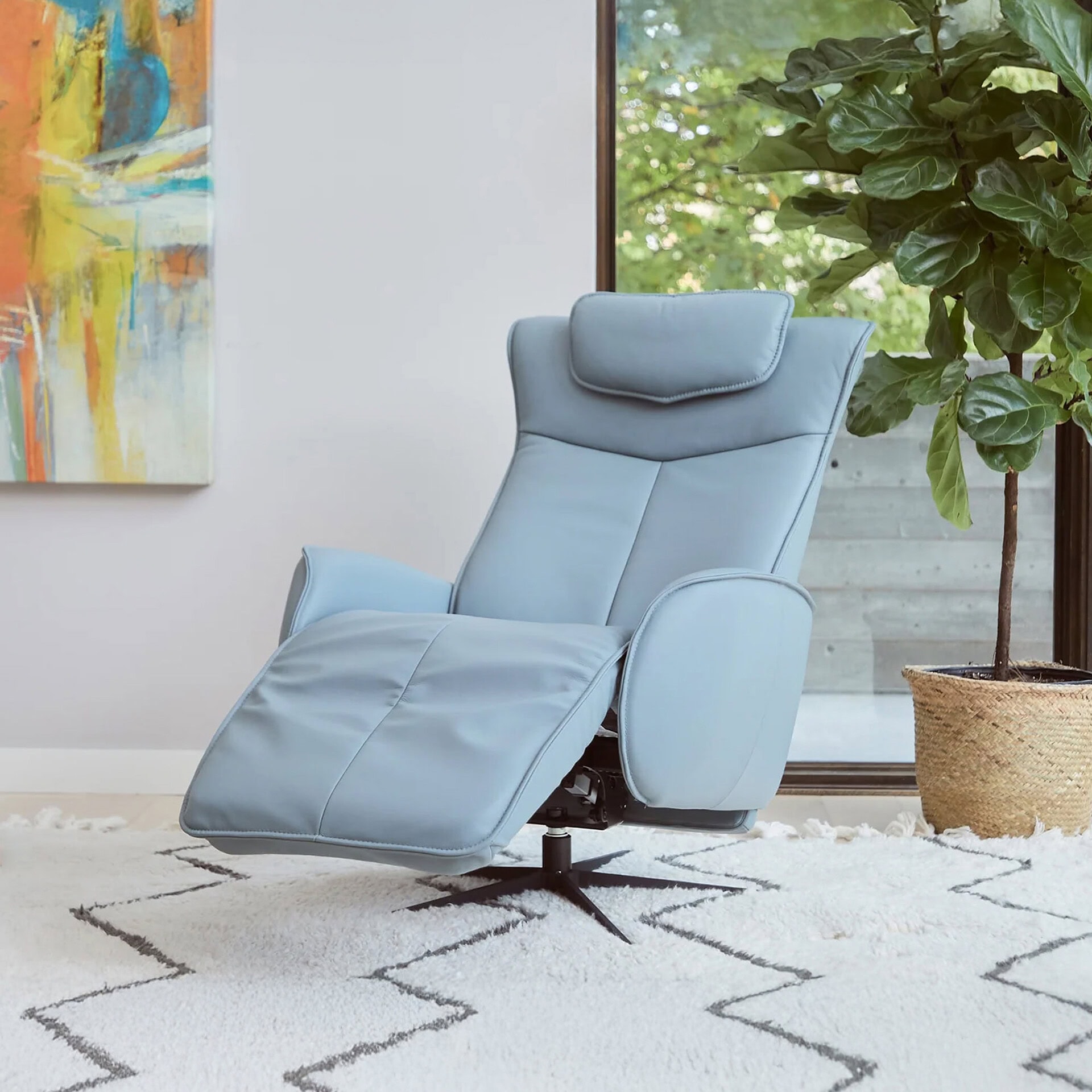 Recliner chair with plush cushioning and modern design, perfect for relaxing in a contemporary livin.