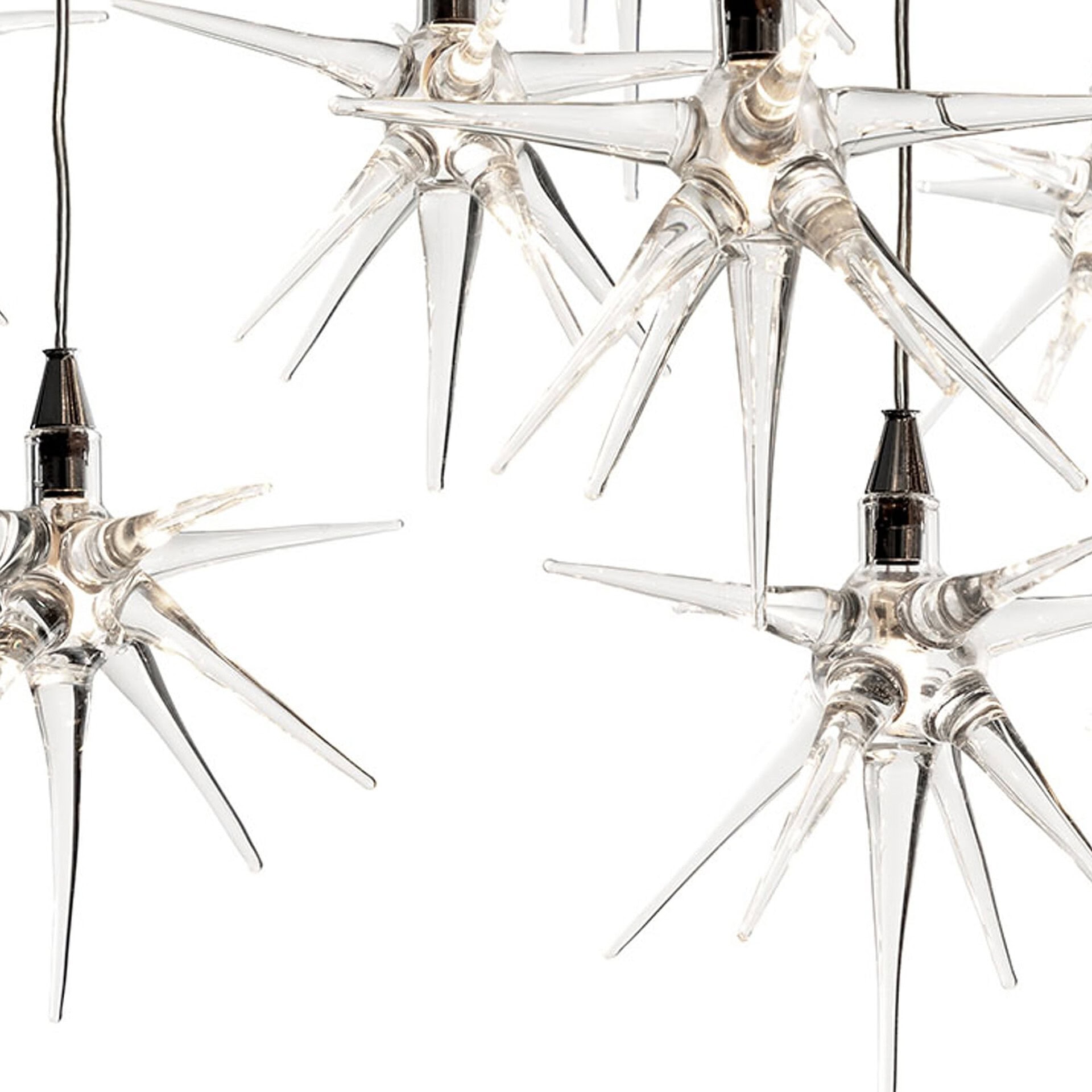 Detailed close-up of Stella Celestial Glass Chandelier glass stars with metal fixtures.