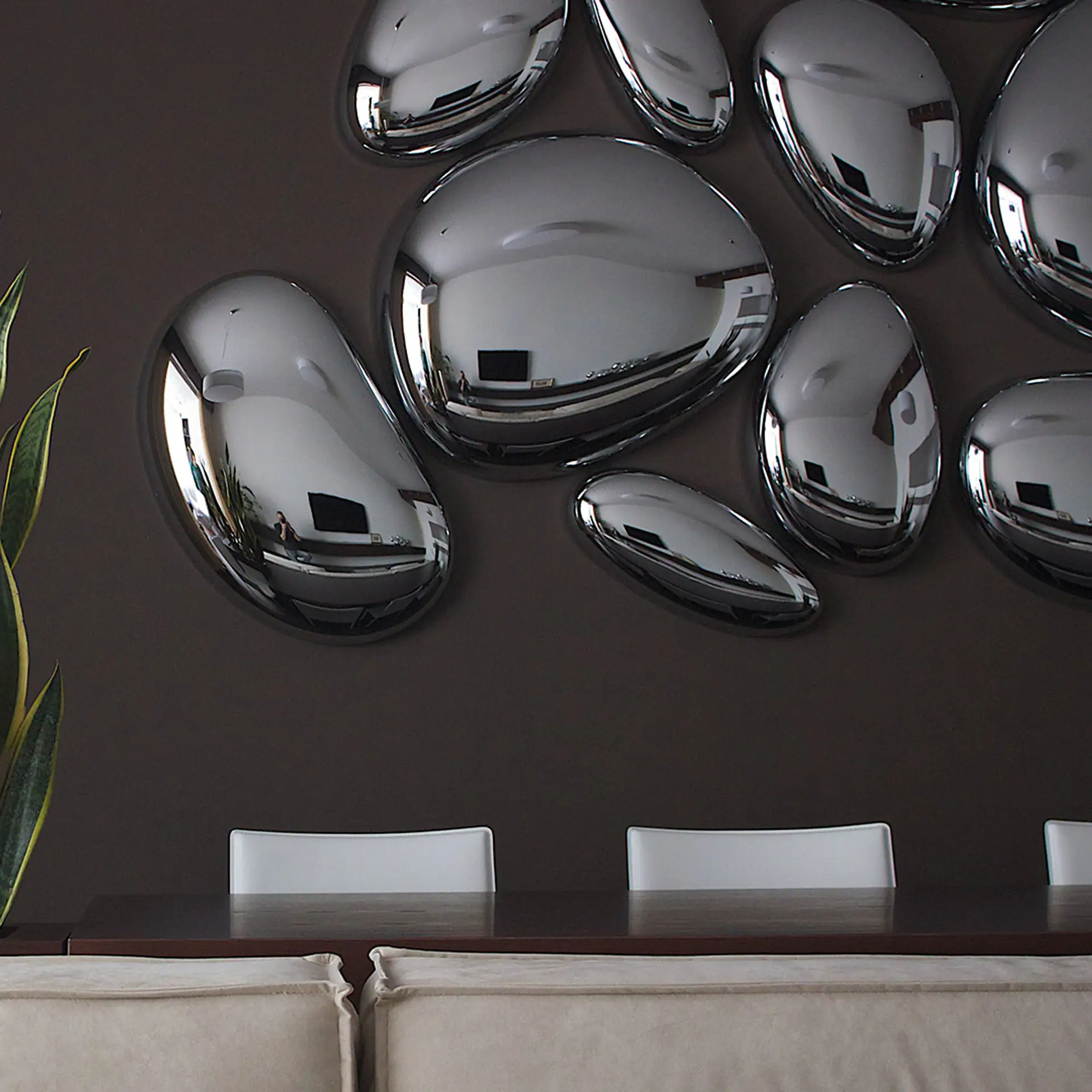 Reflective silver wall sculptures for modern interior decor.