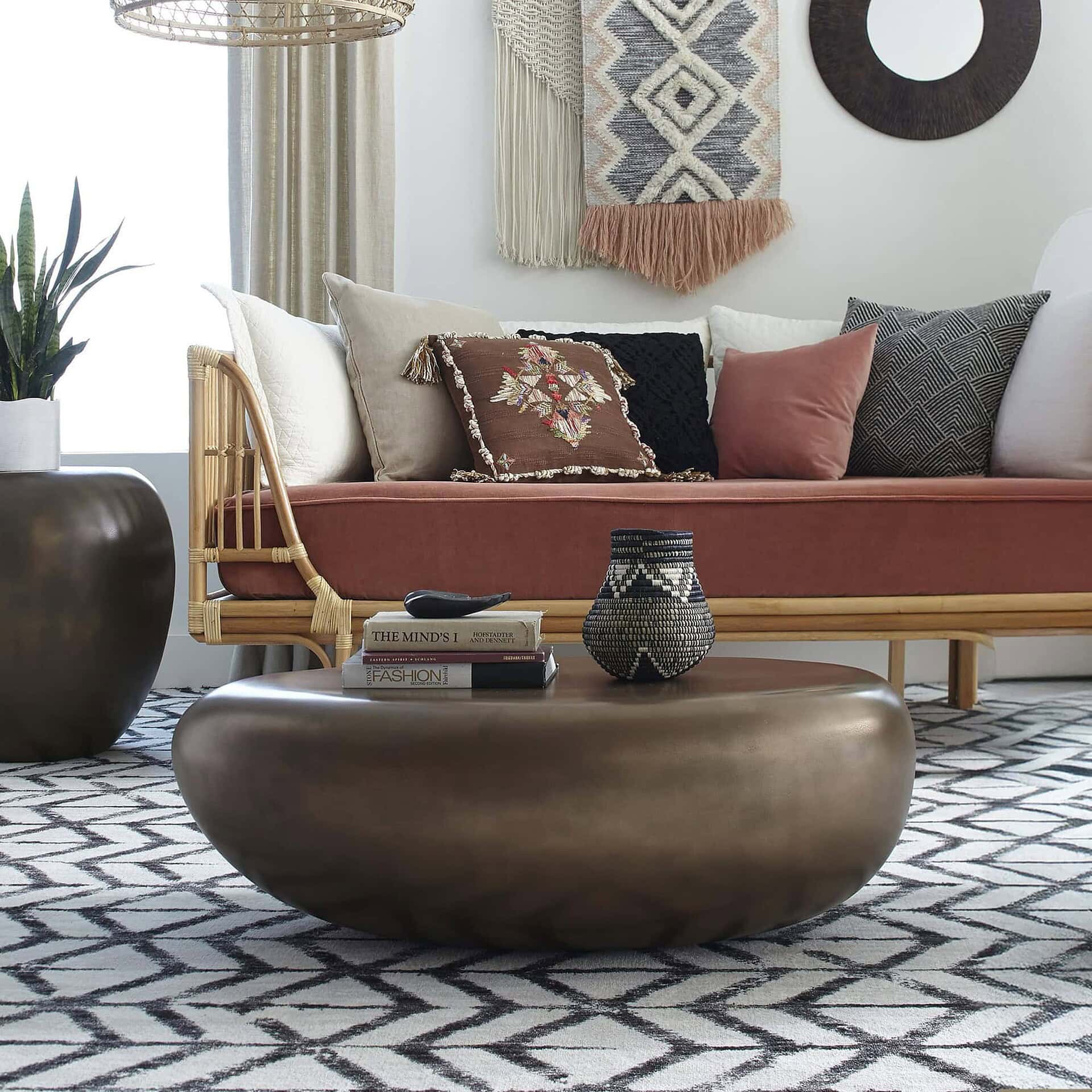 Bronze River Stone Coffee Table in cozy living room with patterned rug.