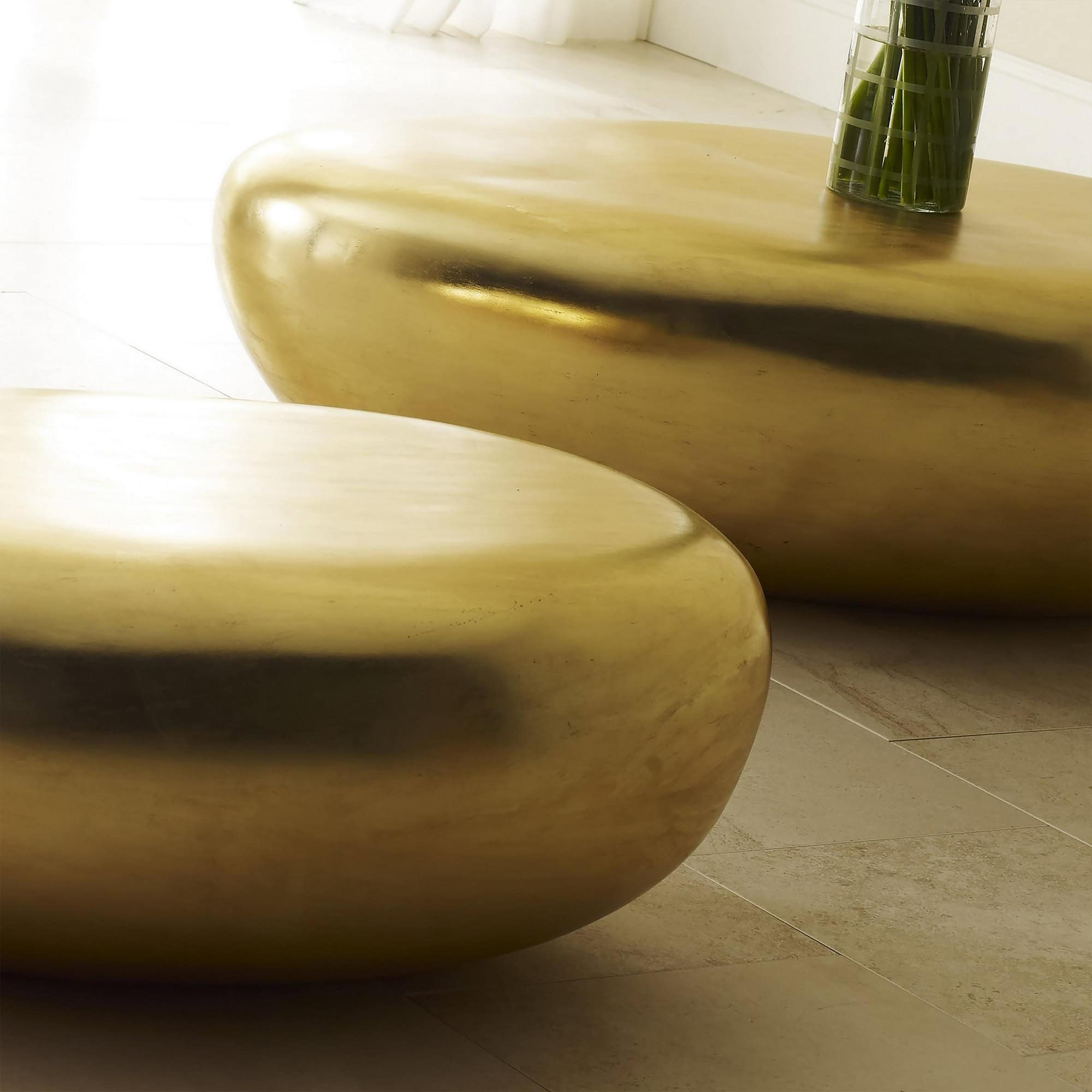 Gold Leaf River Stone Coffee Tables close-up with reflective metallic finish.