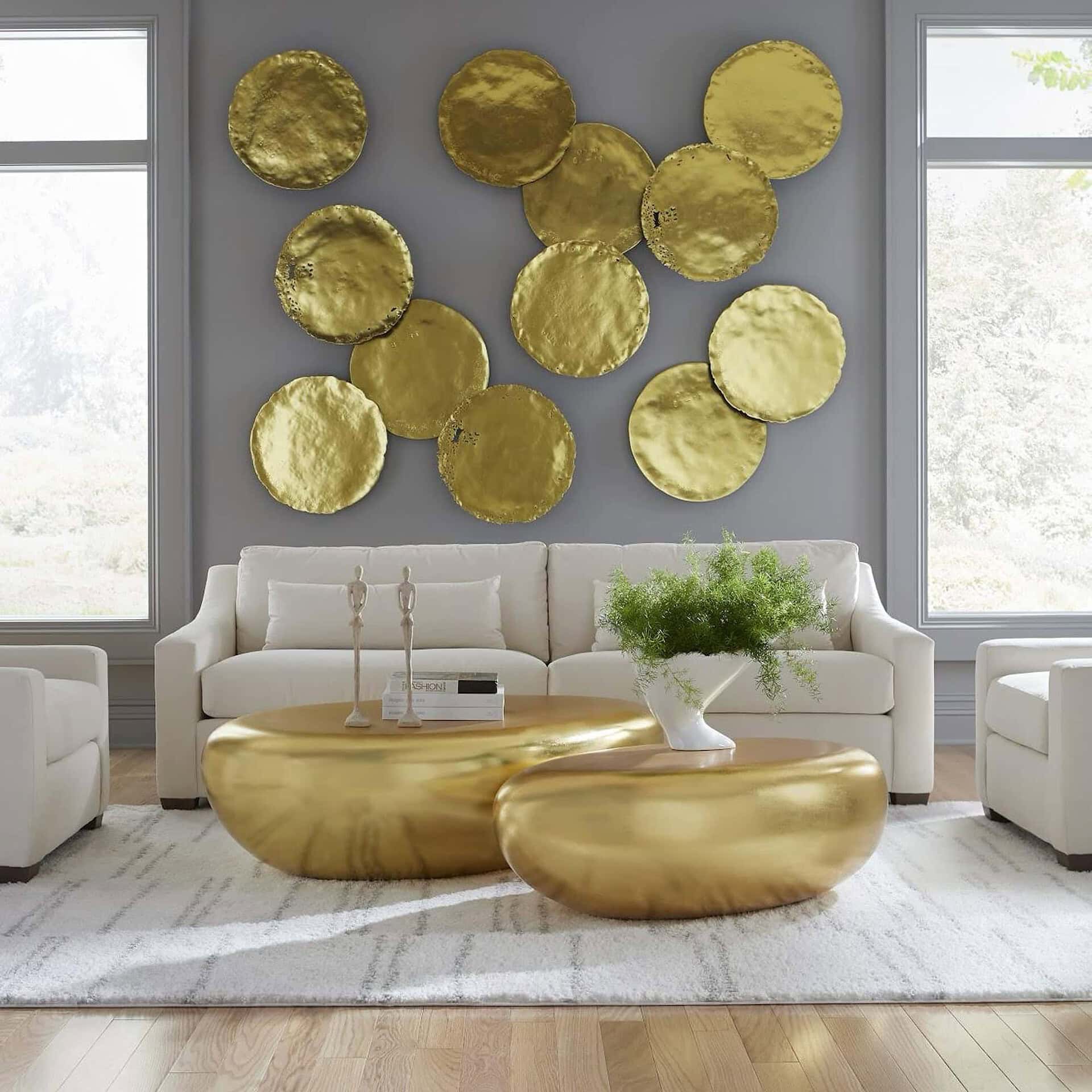 Gold Leaf River Stone Coffee Tables in glamorous living room with wall installation.
