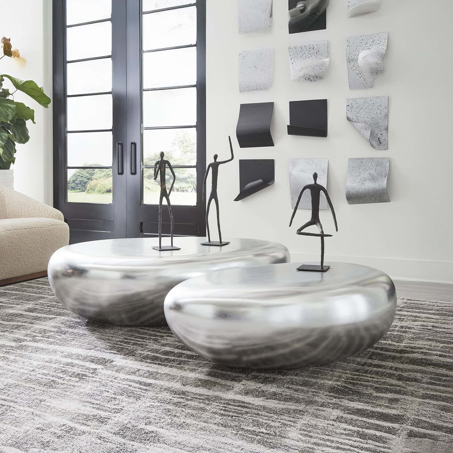 Silver Leaf River Stone Coffee Tables in modern white interior.