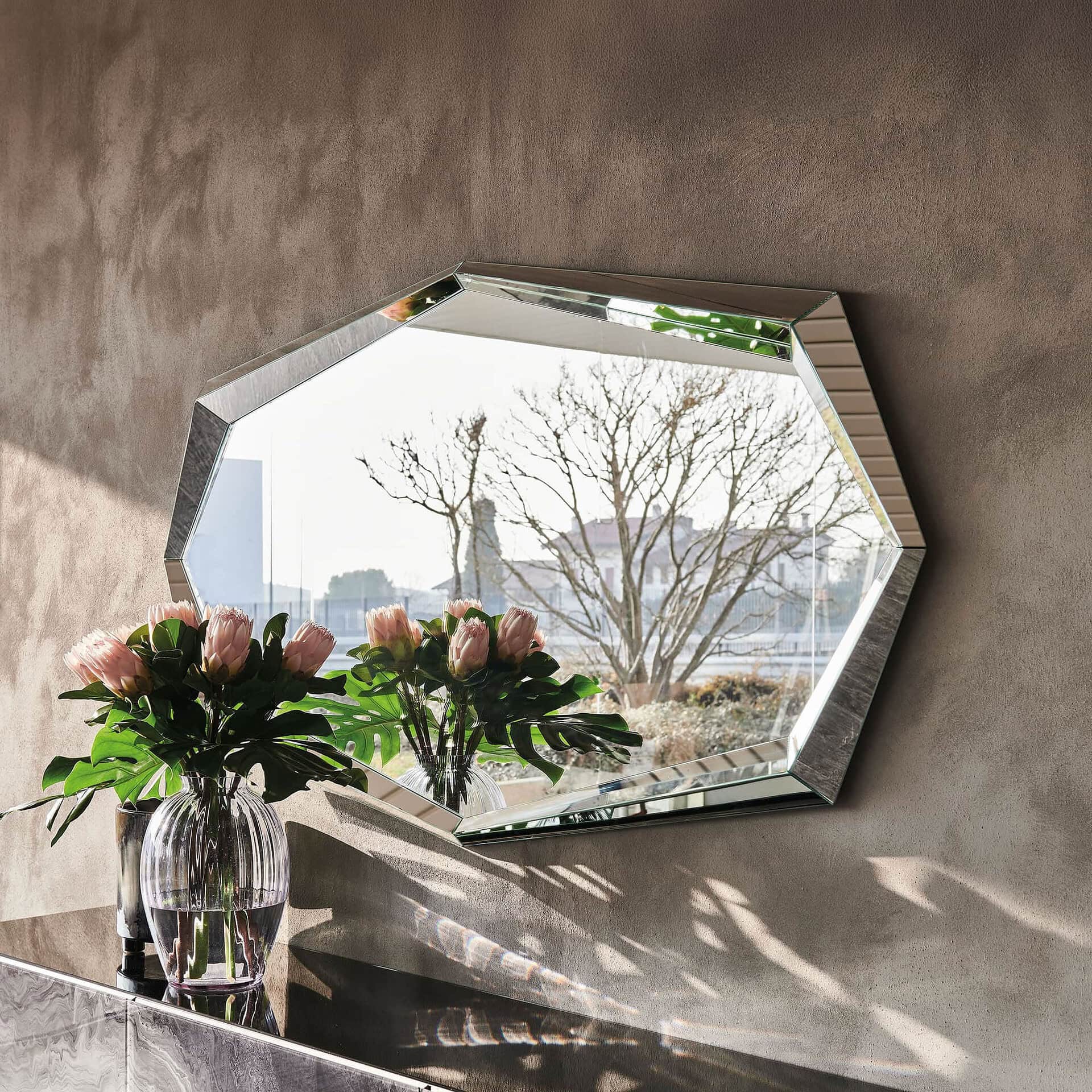 Decorative emerald-shaped wall mirror with beveled edges.
