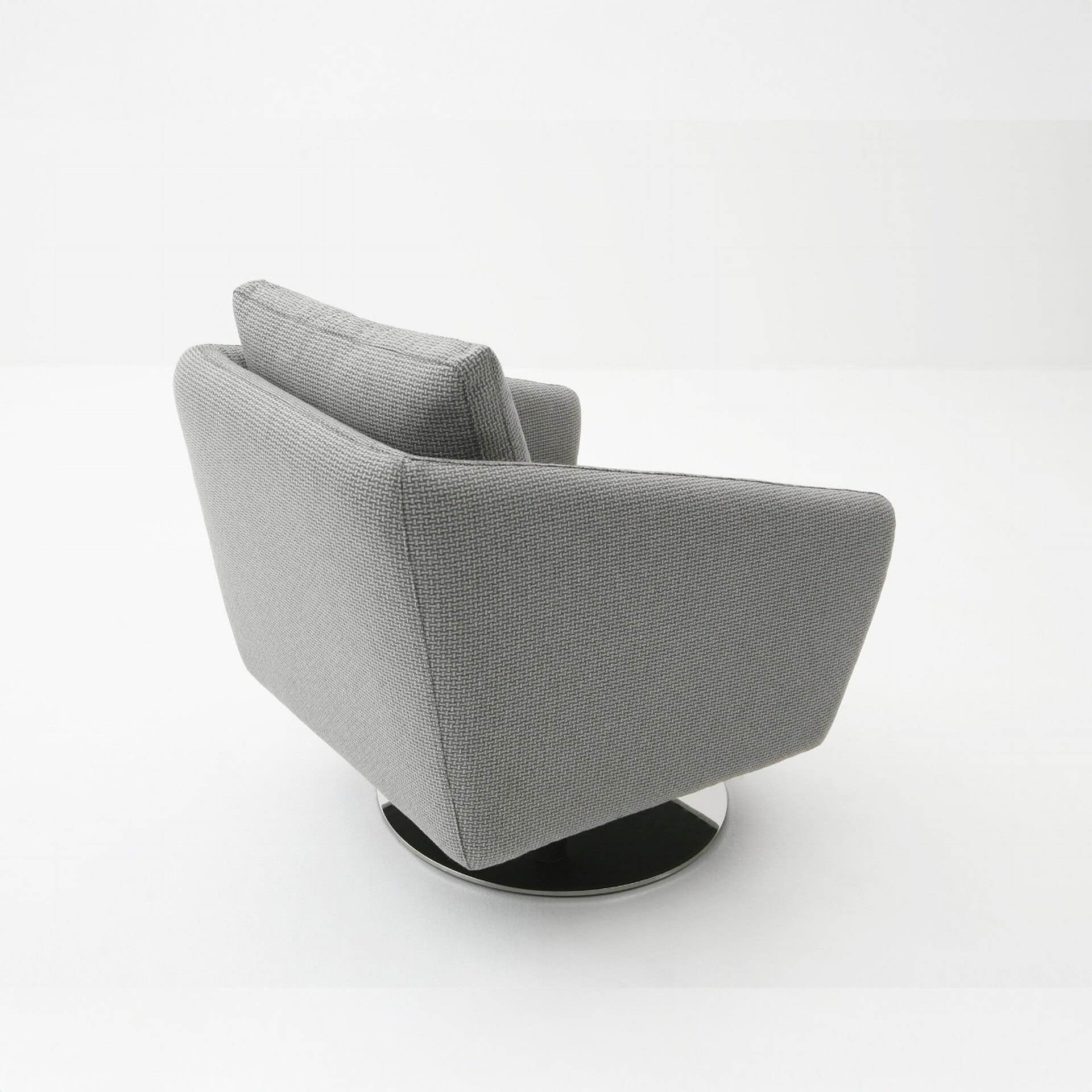 Side and back view of a Regis Upholstered Swivel Chair in light gray fabric, highlighting its angular armrests and polished swivel base.