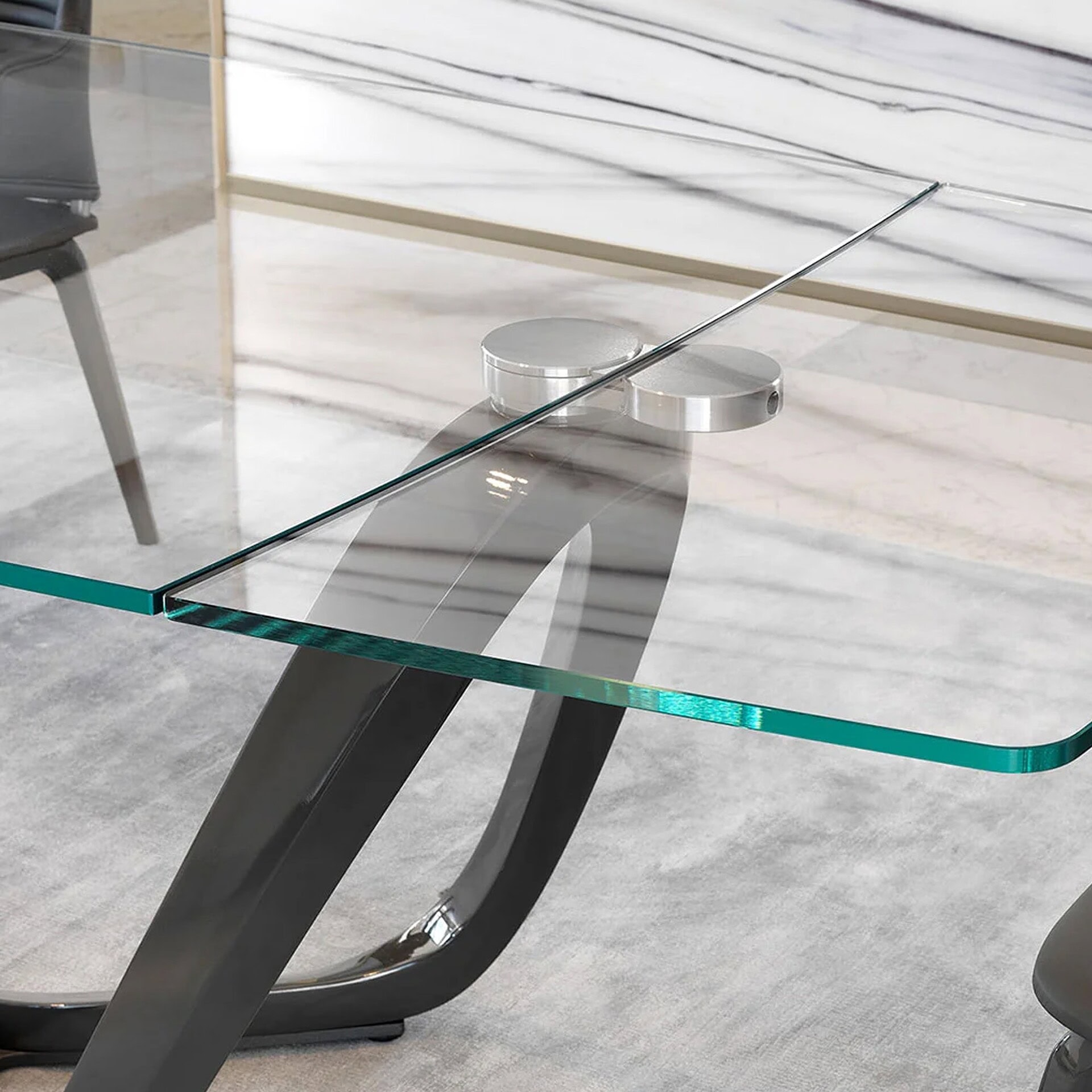 Detail of Segno 72 Dining Table’s sculptural base and beveled glass edge