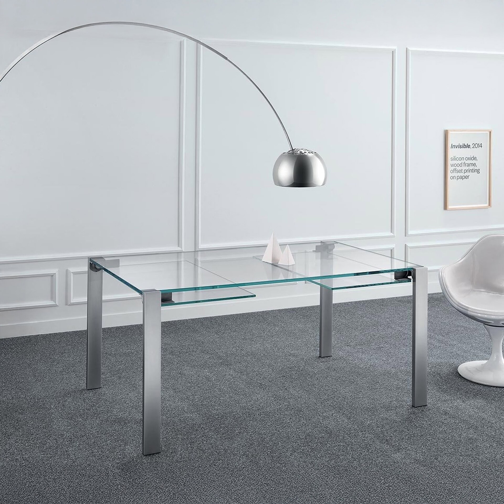 Livingstone Dining Table with glass top and metal legs shown in extended position