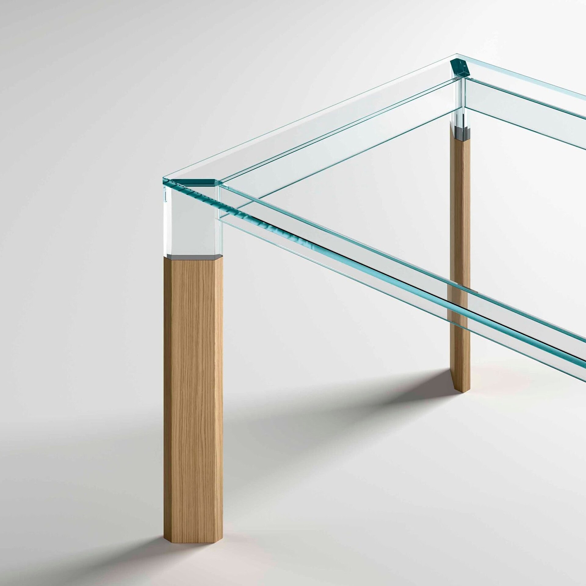 Detail of Perseo Extra-Clear Glass Dining Table with solid wood leg support