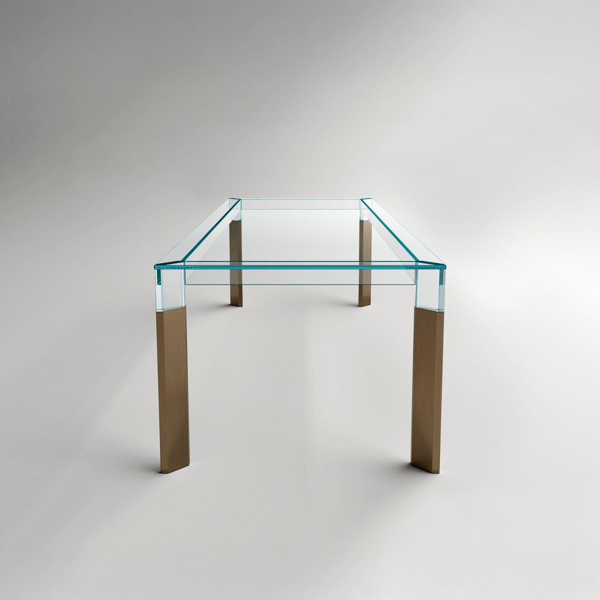 Perseo Extra-Clear Glass Dining Table with wooden legs, studio front angle