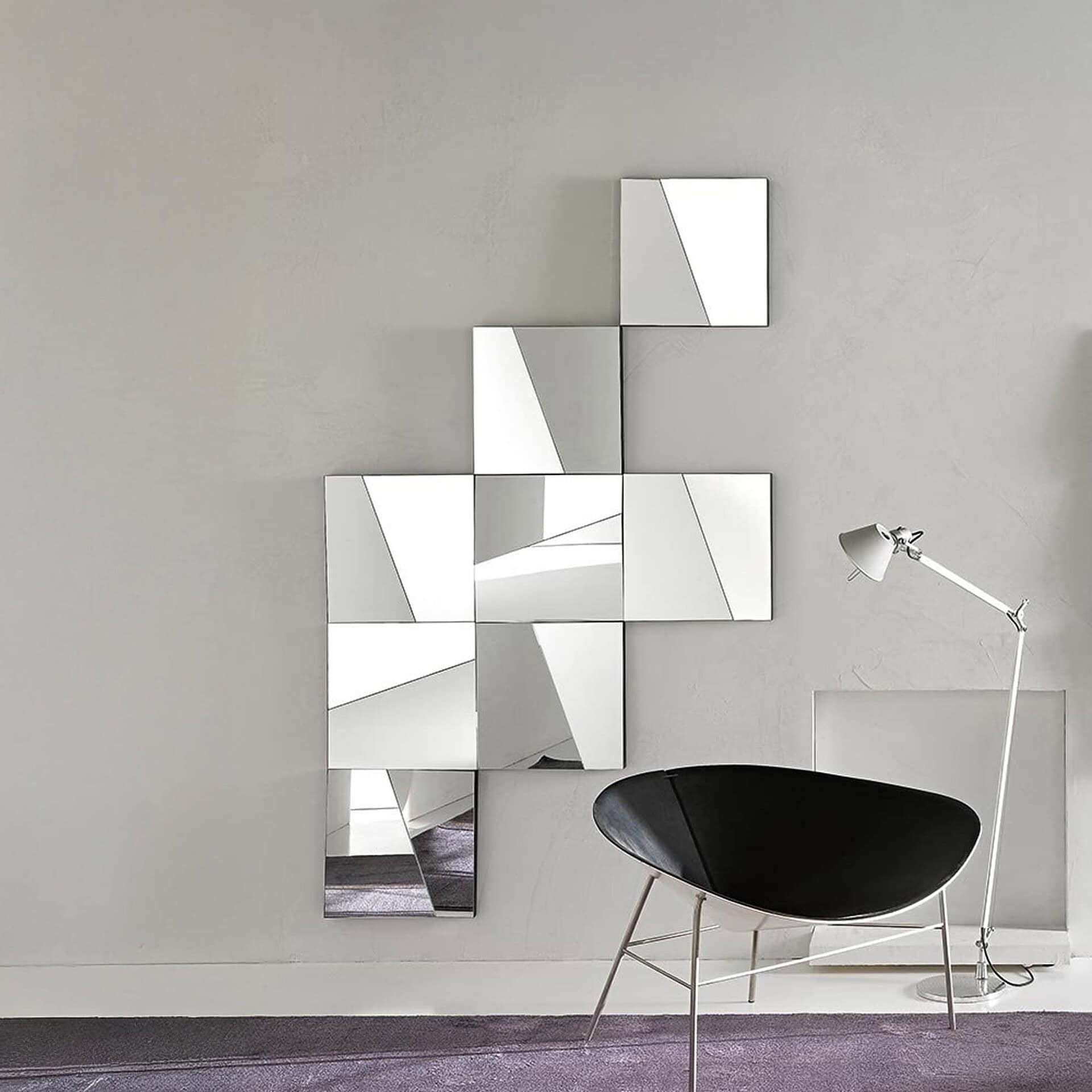 Modular arrangement of Stati d’Animo mirrors installed vertically, creating a striking sculptural wall feature.