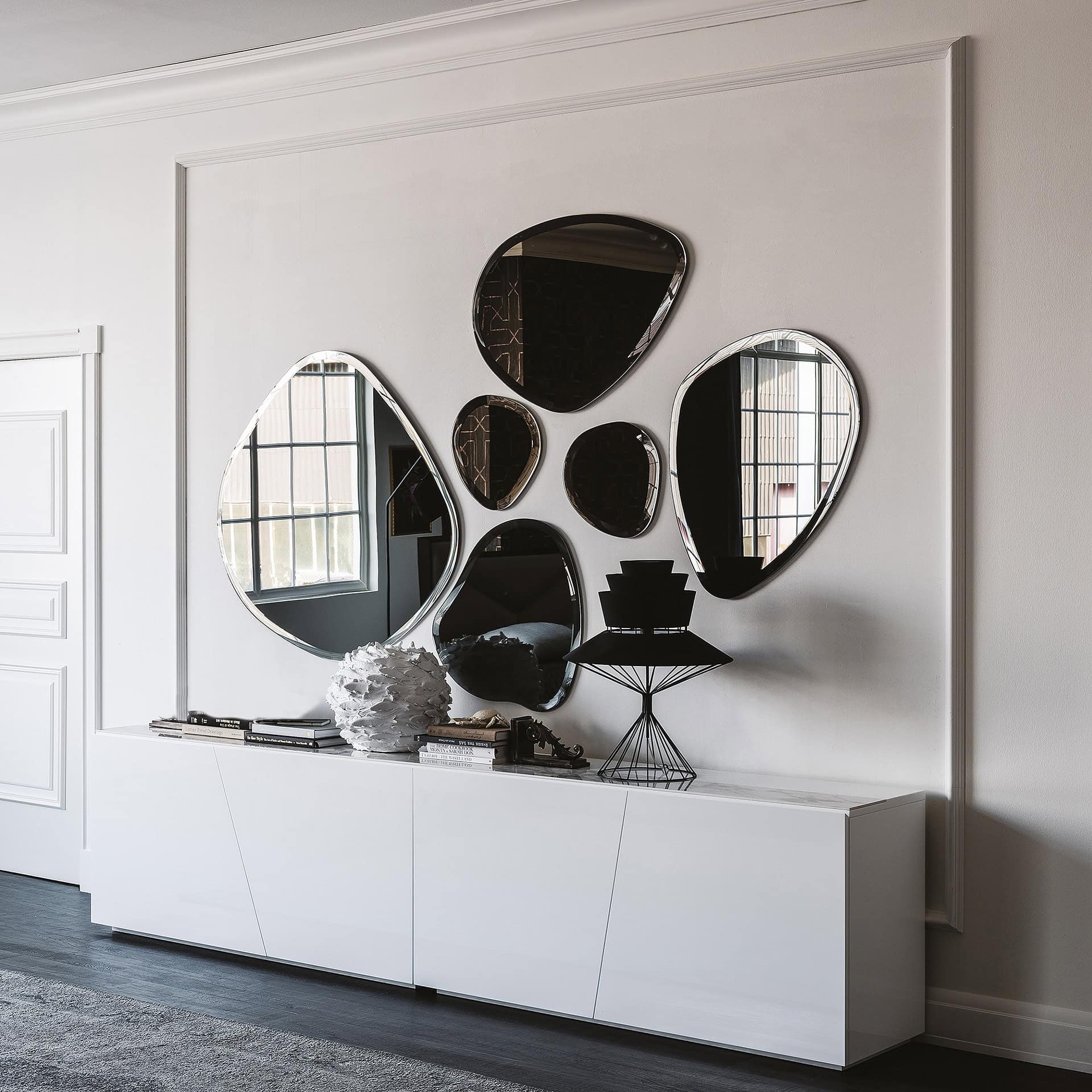 Hawaii Sculpted Wall Mirrors displayed in a modern white living room arrangement.