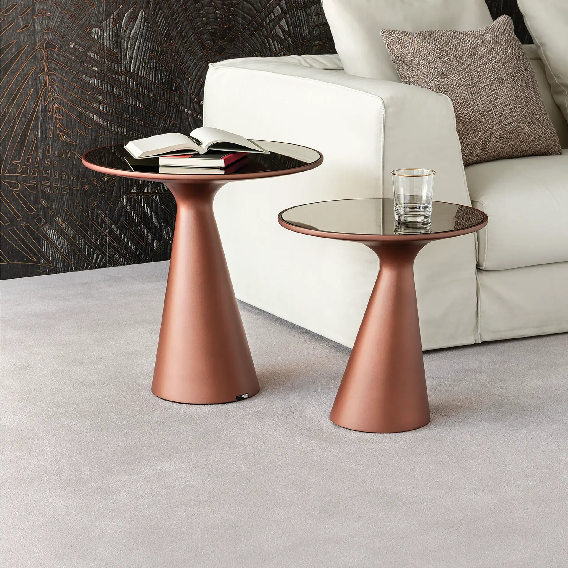 Sklar Furnishings Peyote End Table set with glass tops next to a white sofa.