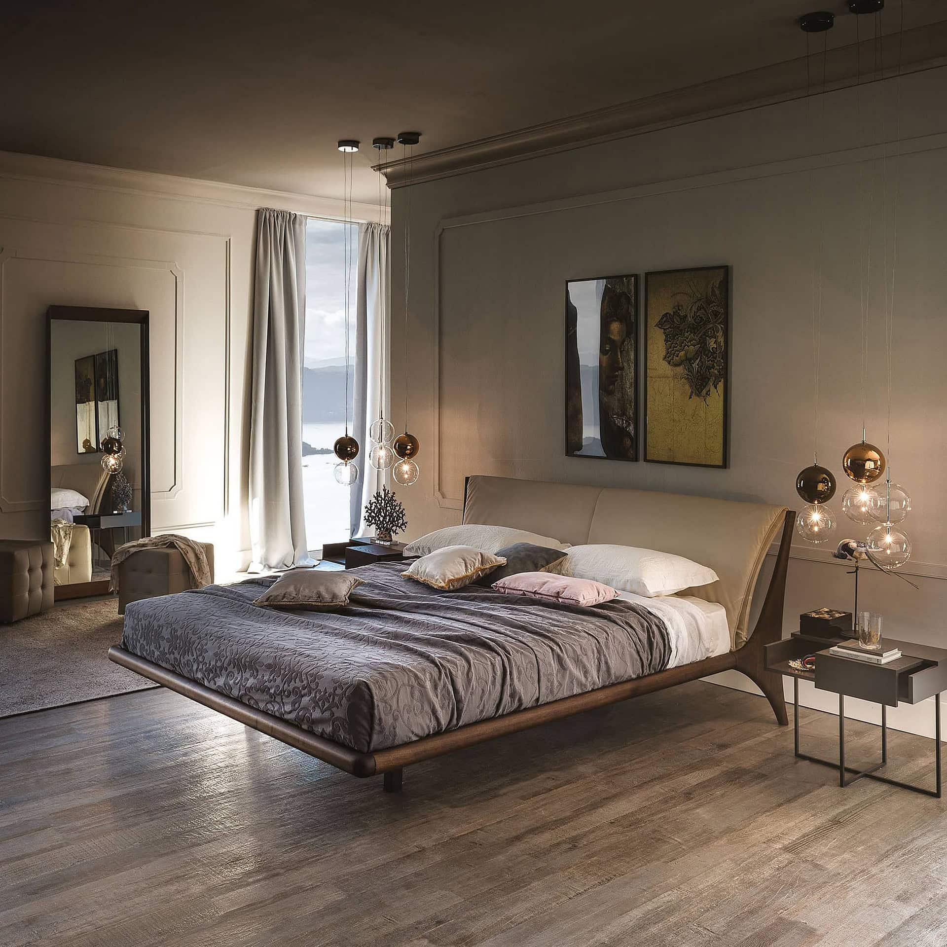 Warm-toned bedroom featuring Nelson Wood Frame Upholstered Bed in soft gray fabric, accented with wood floors and neutral bedding.