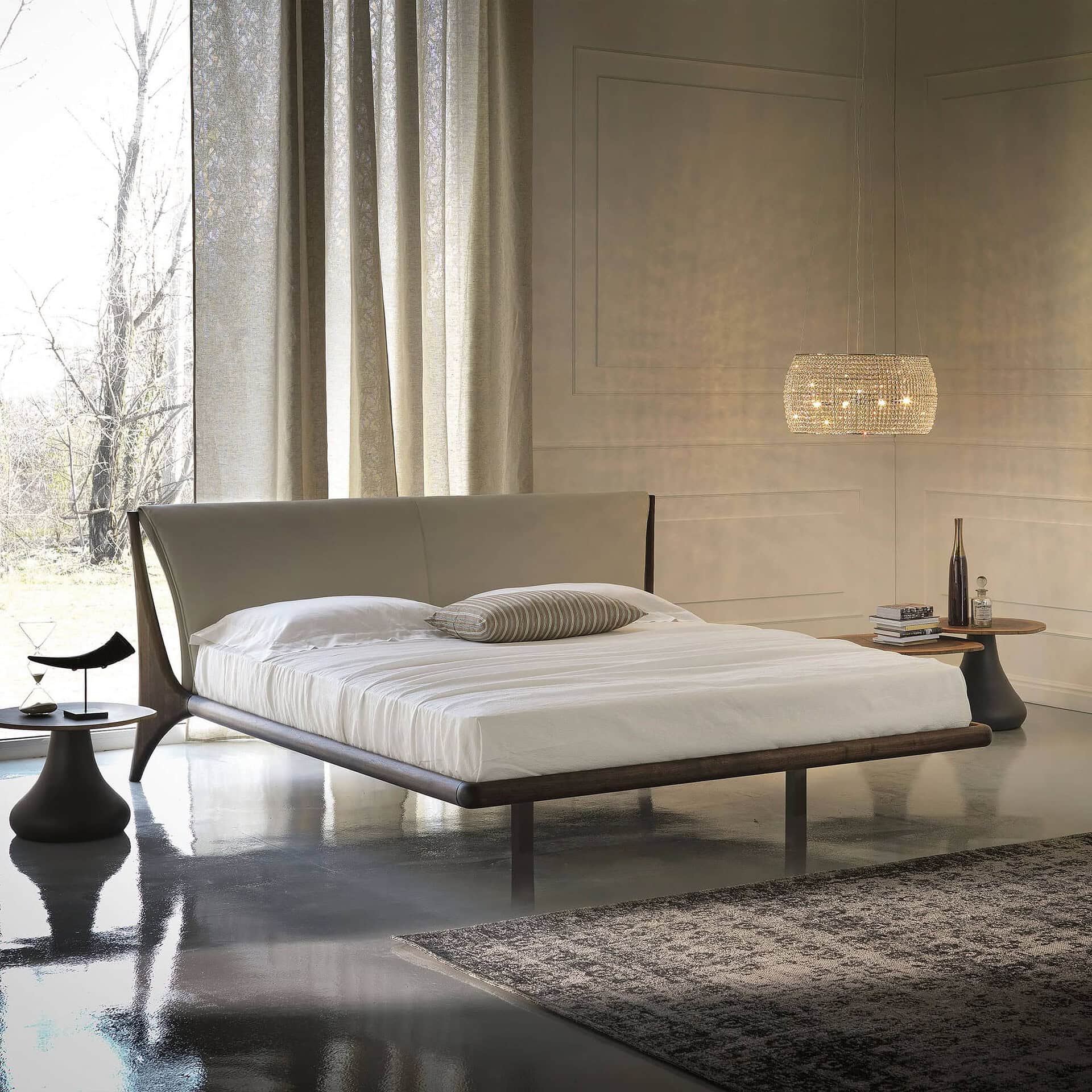 Minimalist bedroom featuring Nelson Wood Frame Upholstered Bed in light upholstery with oak frame, paired with modern side tables.