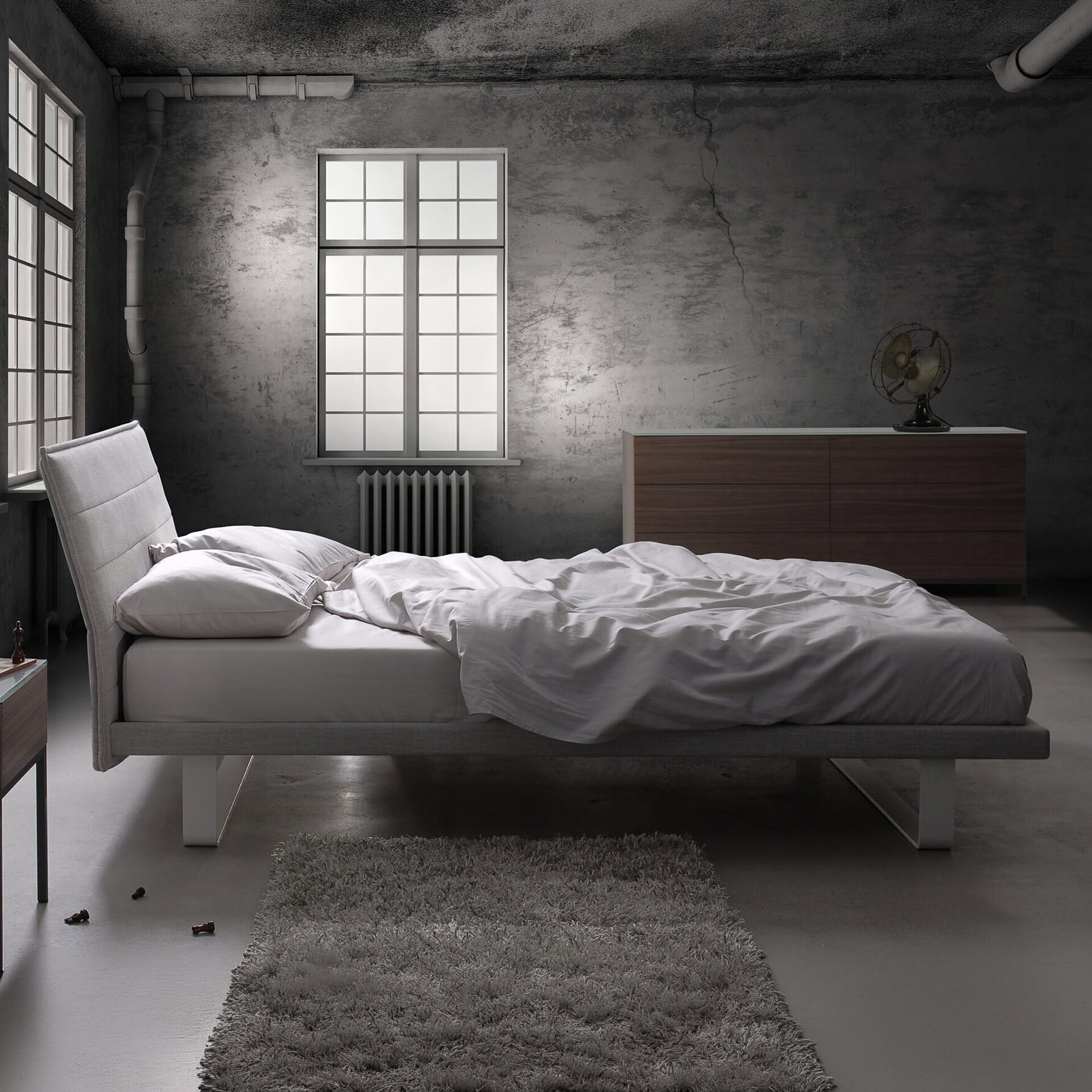 Modern Envy upholstered platform bed in a minimalist industrial bedroom setting.