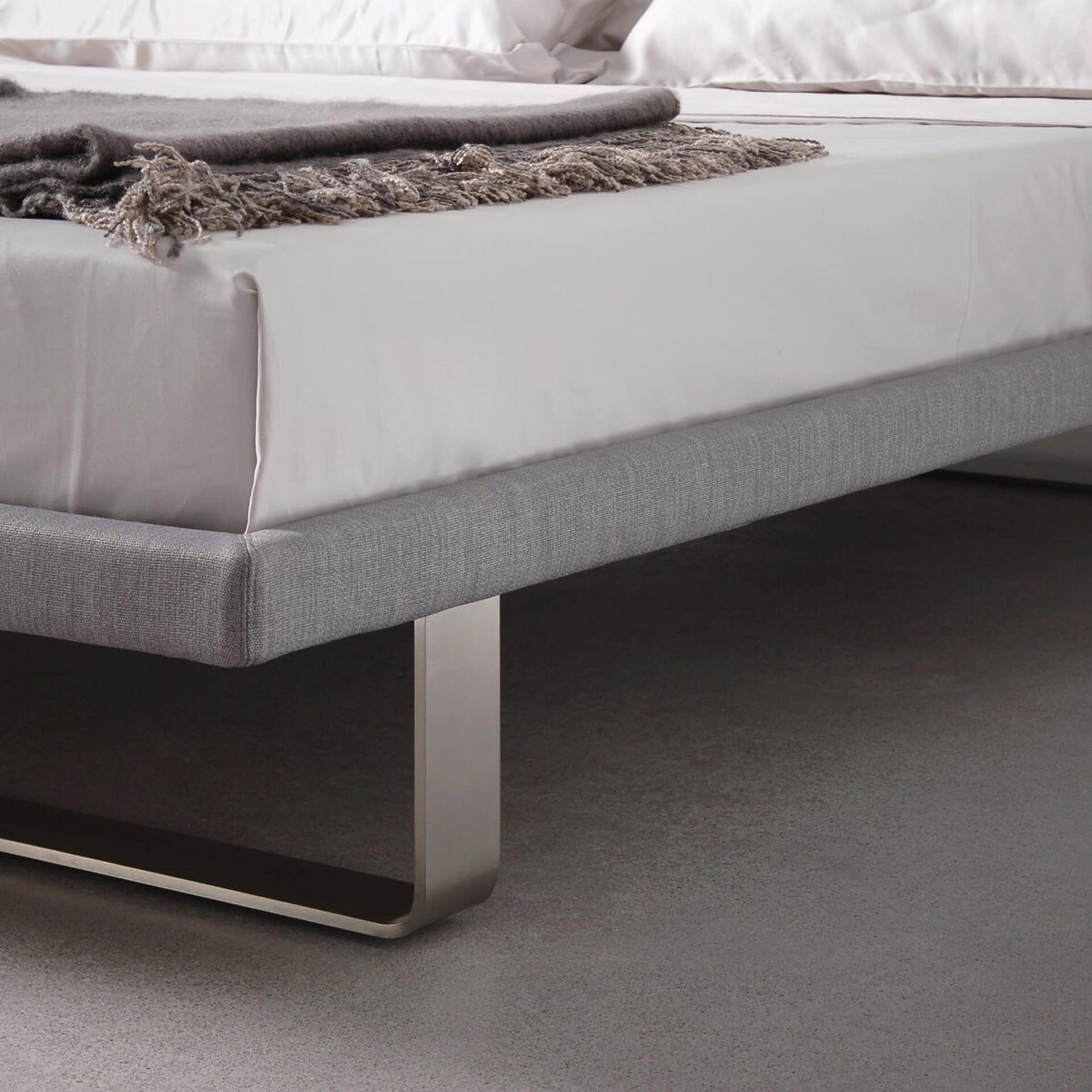 Envy upholstered platform bed with sleek design and modern comfort. Perfect for contemporary bedroom.