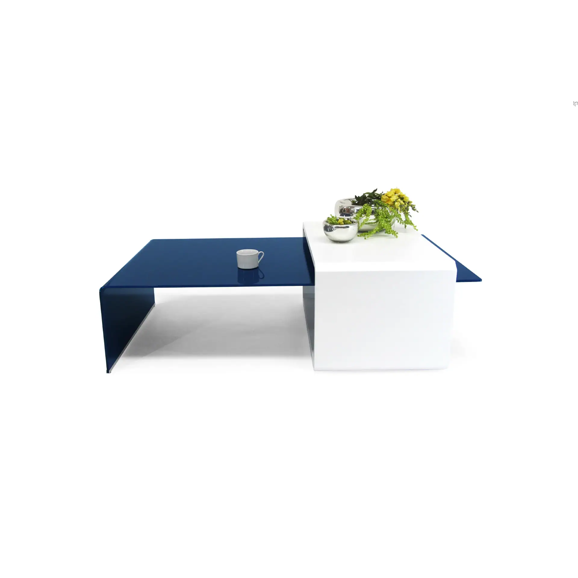 Modern modular coffee table with blue and white sections, decorated with plants and a mug.