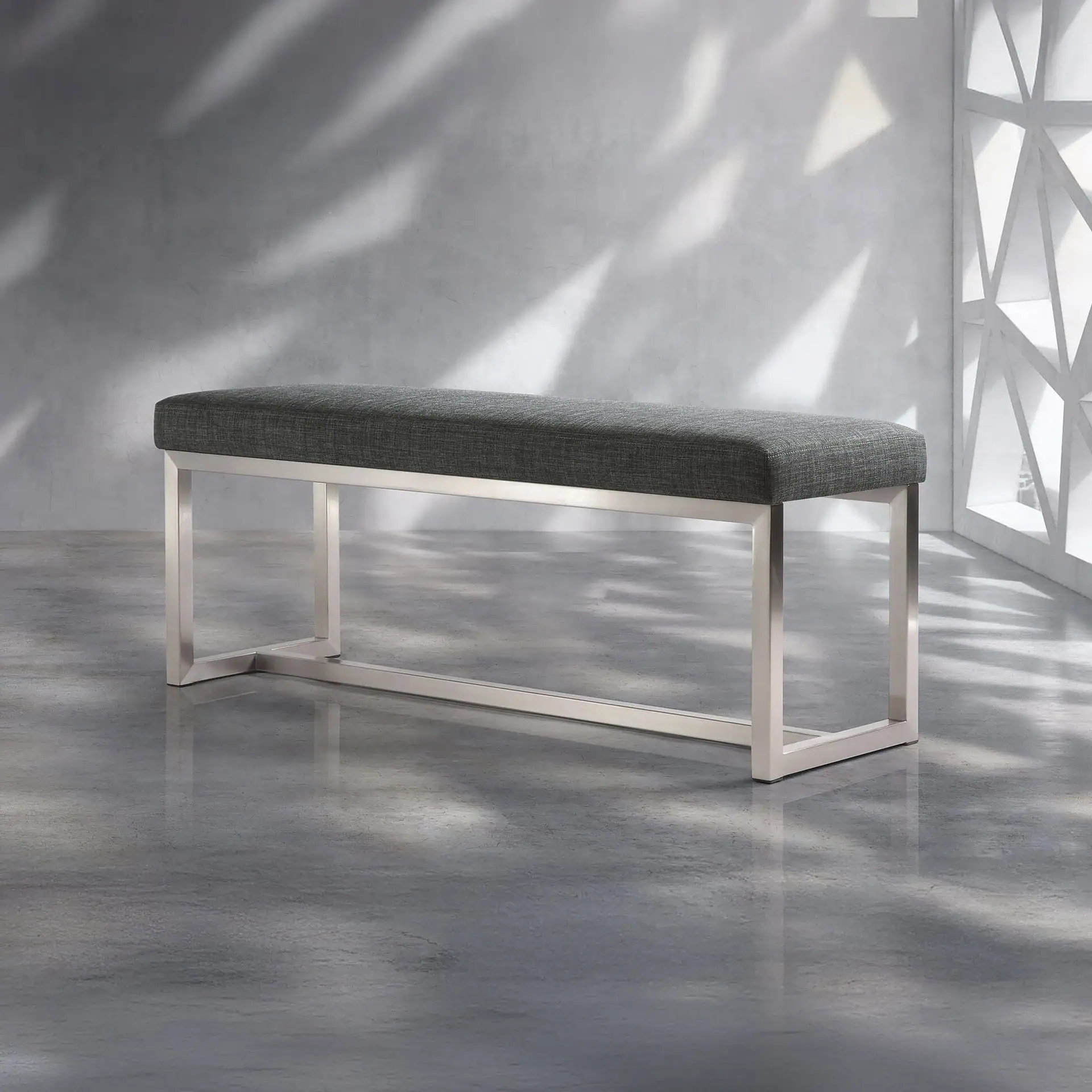 Upholstered bench with gray fabric and sleek metal frame, ideal for entryways or living rooms.