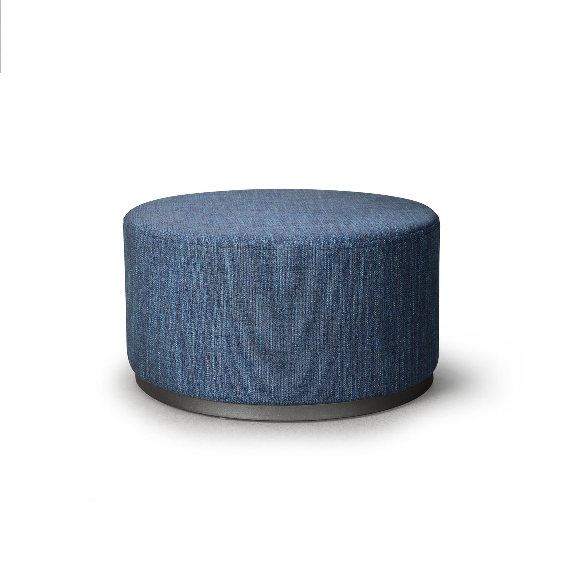 Blue upholstered round ottoman for modern living room decor.