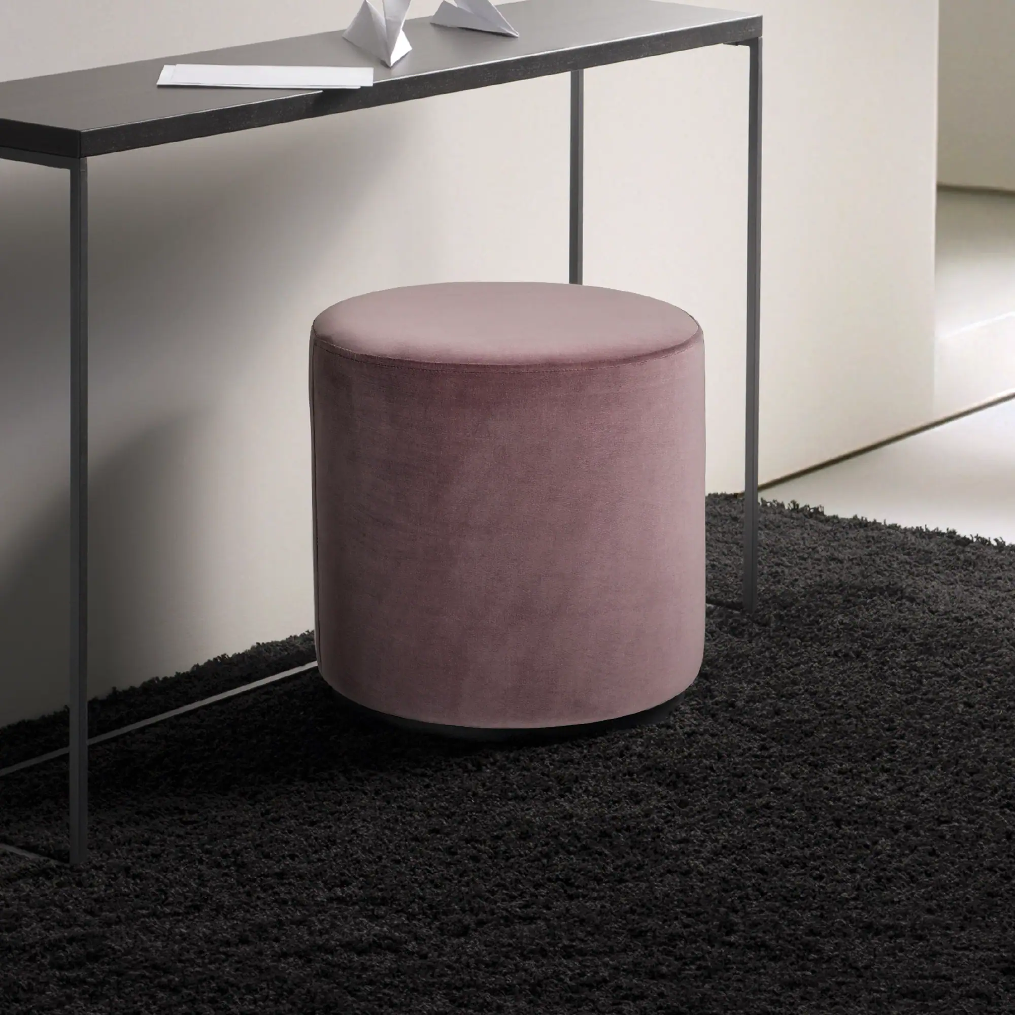 Sklar Furnishings Marshmallow Ottoman in pink fabric in a modern room.